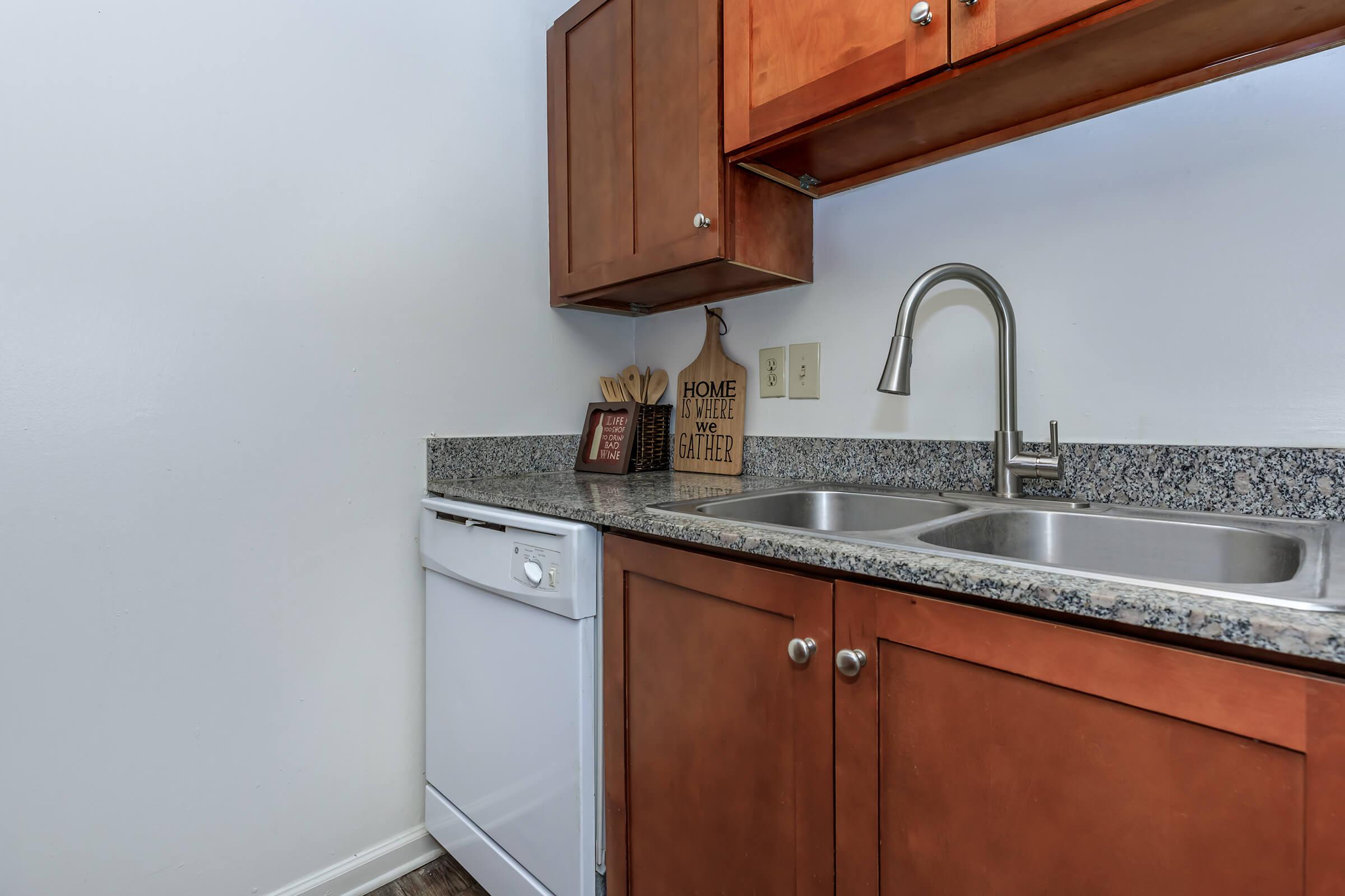 a kitchen with a stove sink and refrigerator