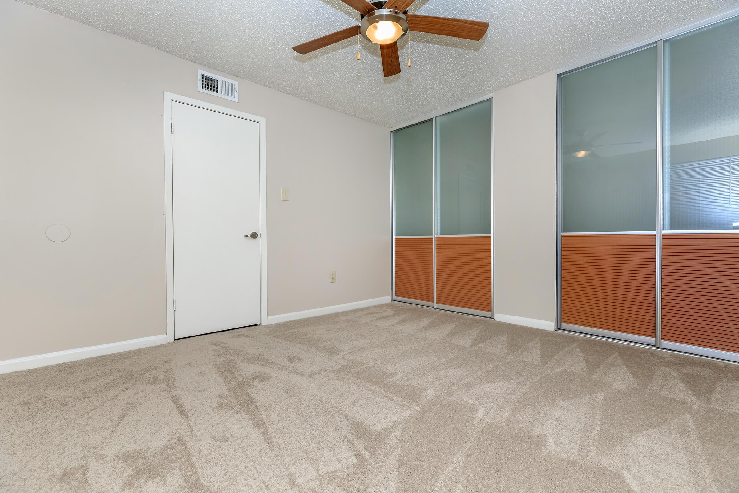 a bedroom with a bed in a room