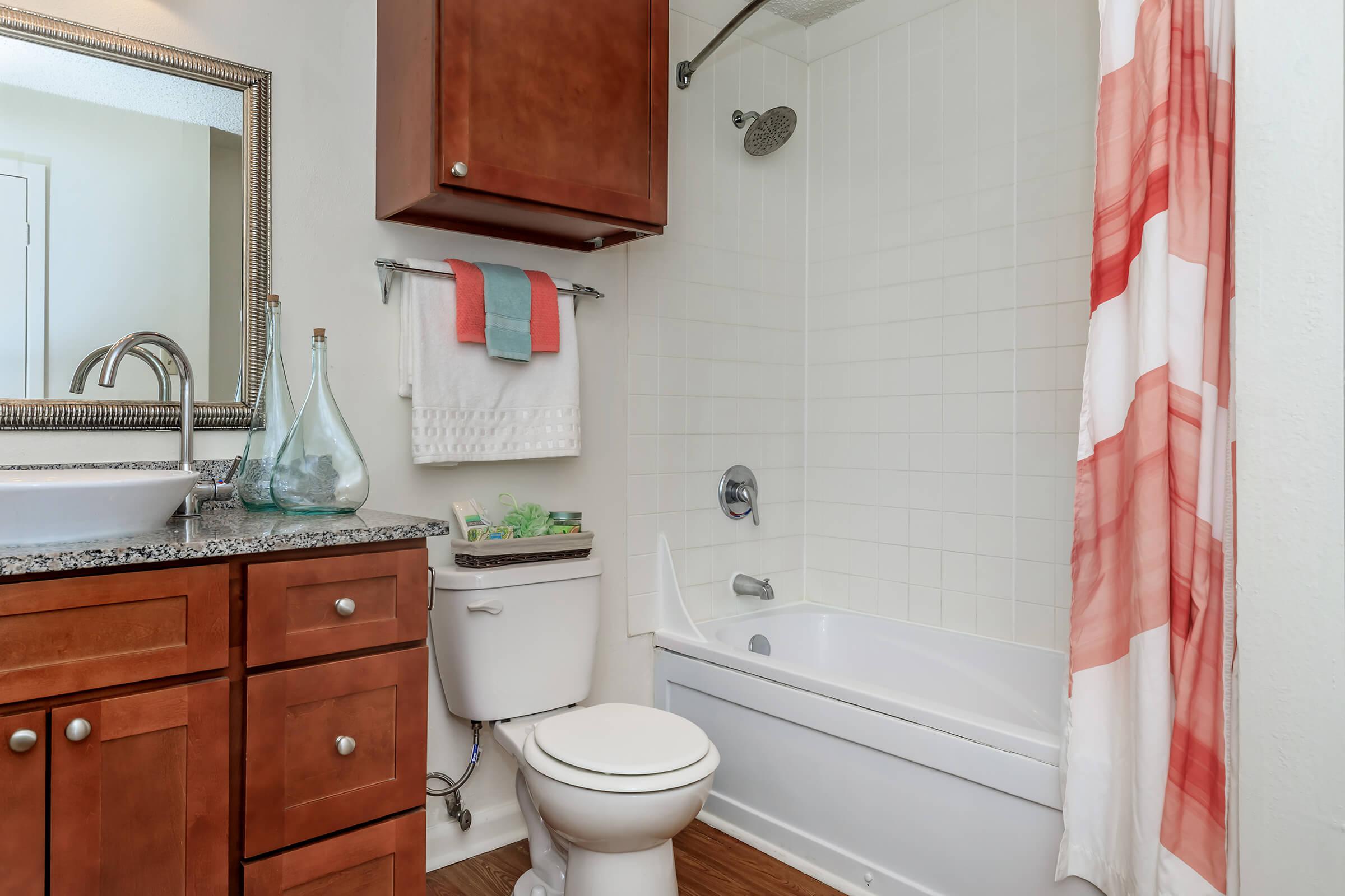 a room with a sink and a mirror