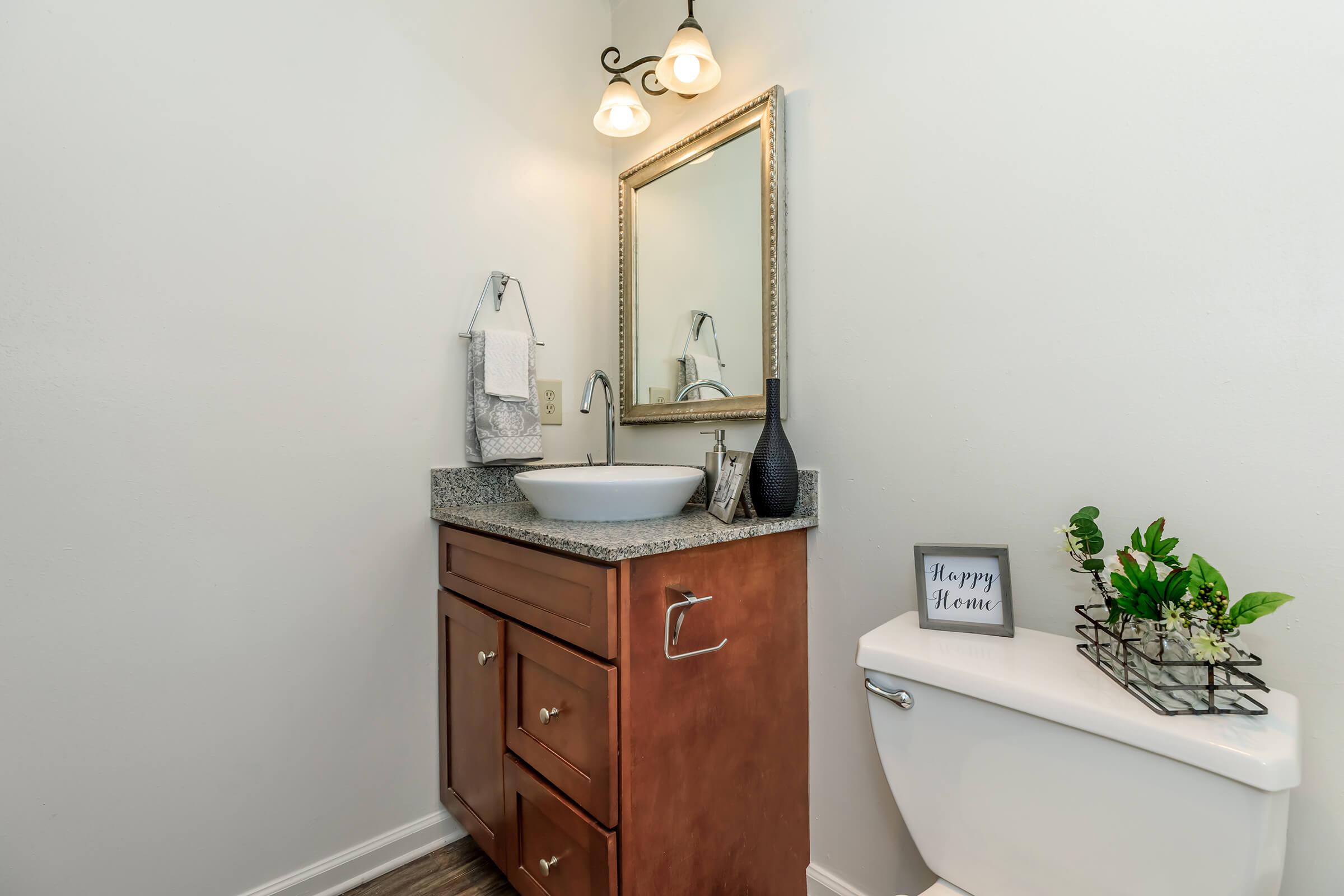 a room with a sink and a mirror