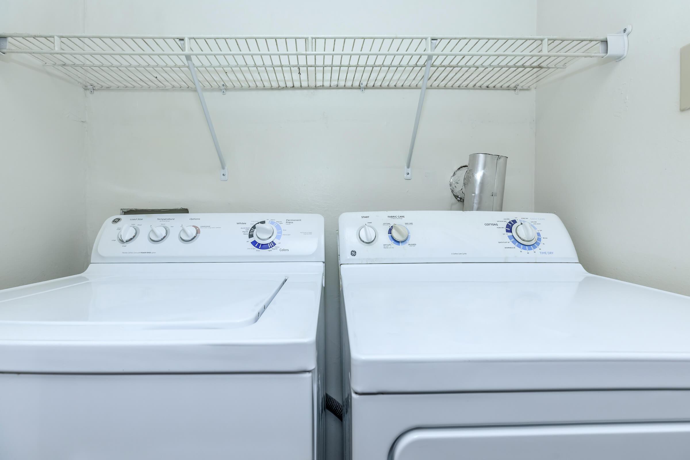 a stove top oven sitting next to a sink