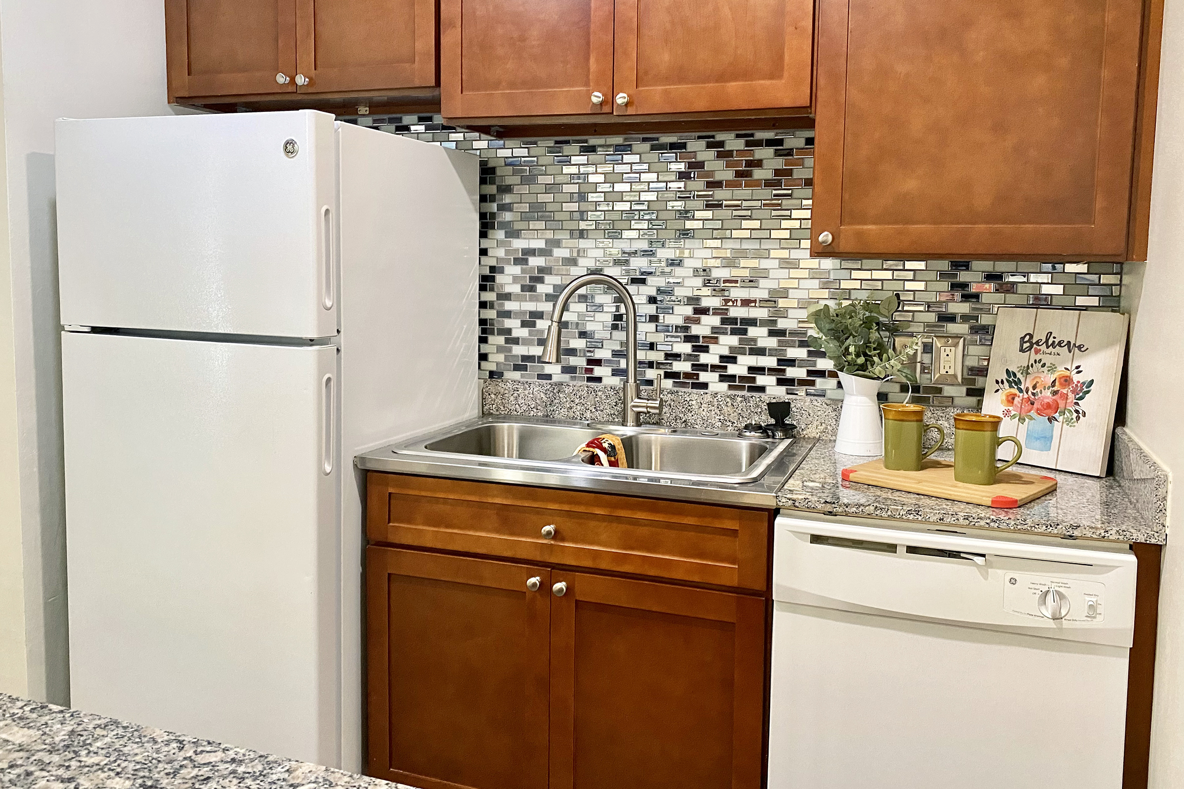 a stainless steel refrigerator in a kitchen