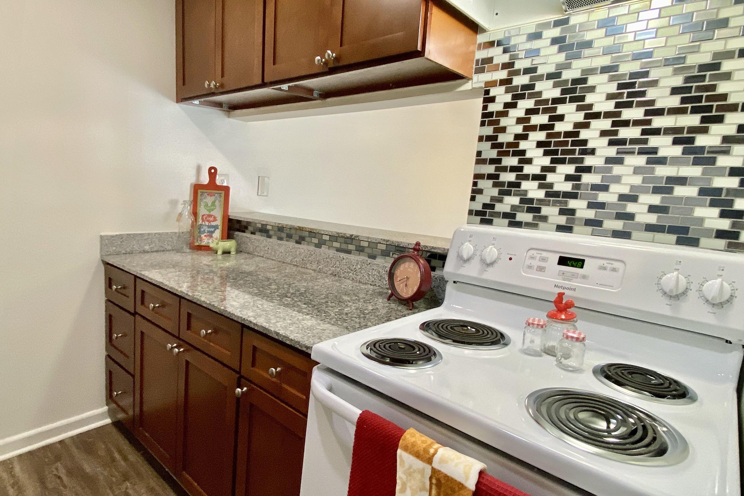 a kitchen with a stove top oven sitting inside of a refrigerator