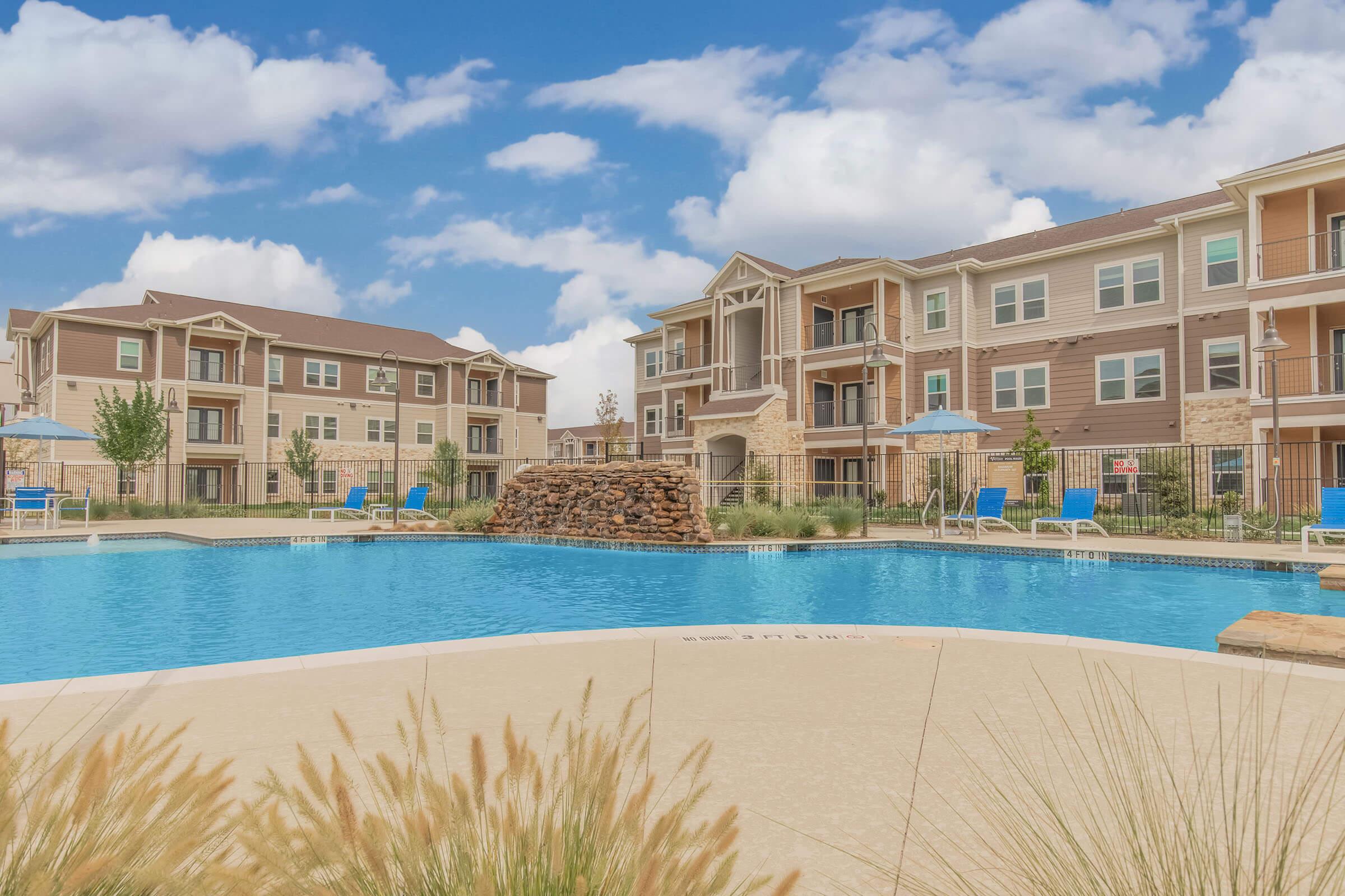 a large pool of water in front of a building