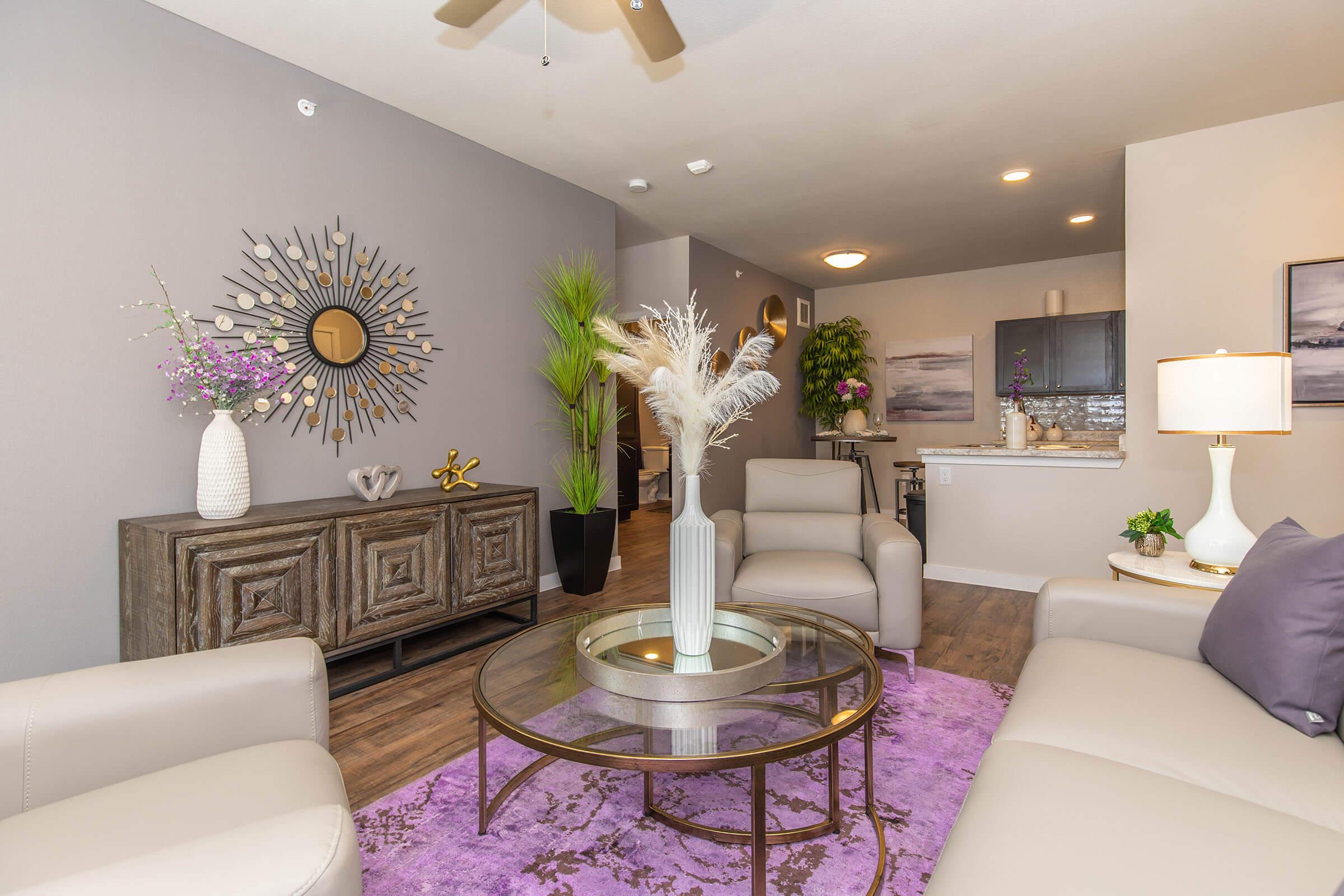 a living room filled with furniture and a fire place