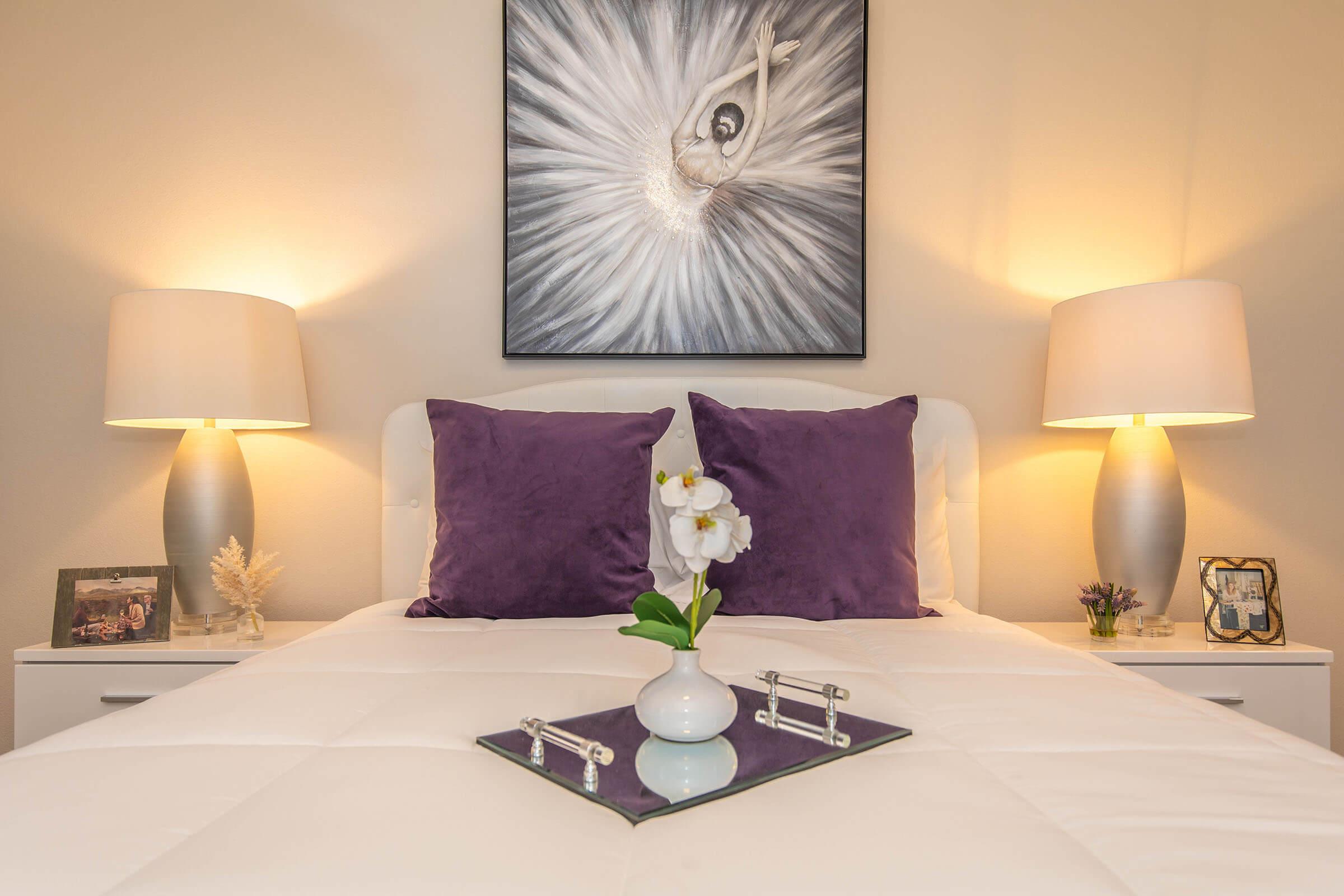 a bedroom with a large bed in a hotel room