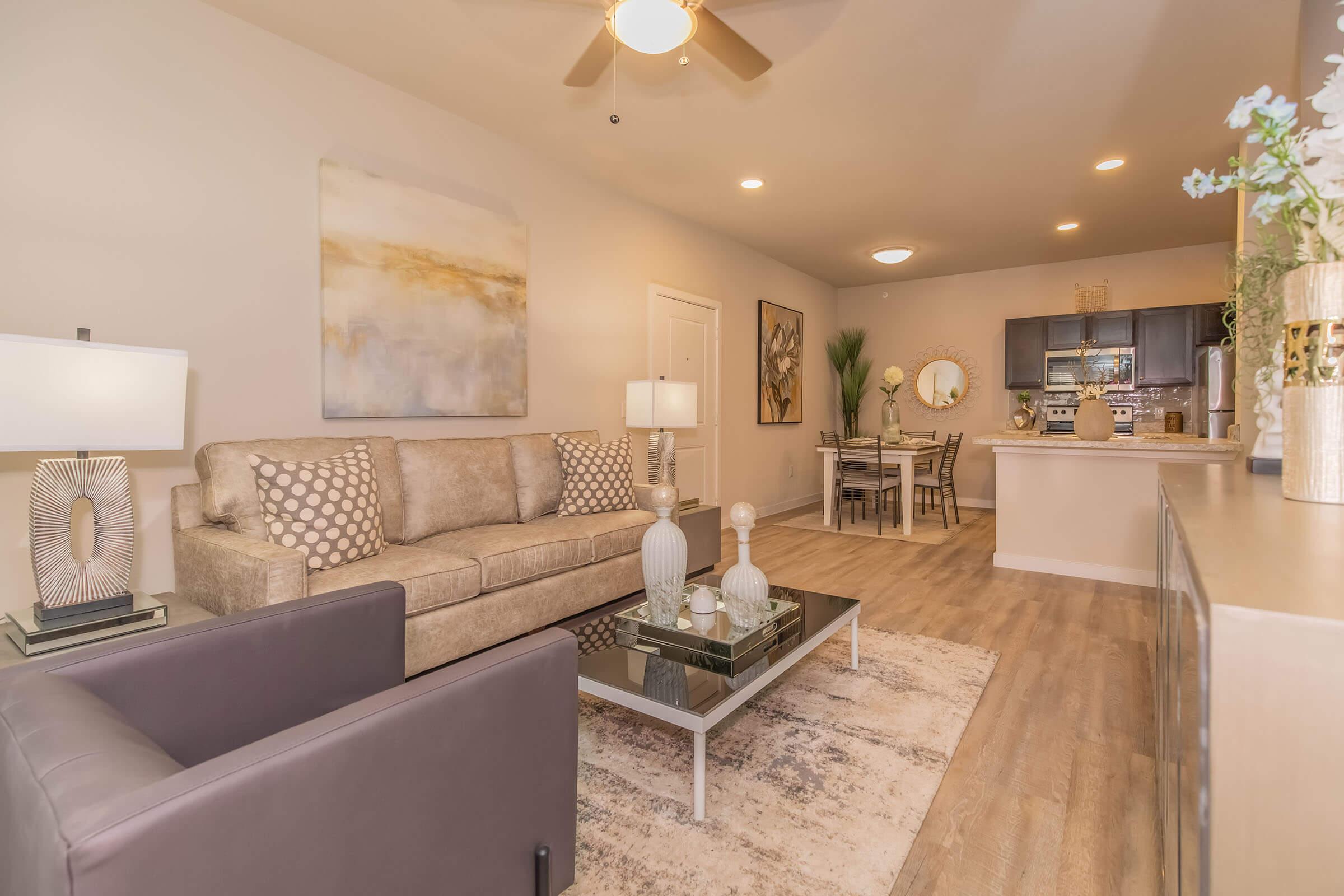 a living room filled with furniture and a fireplace