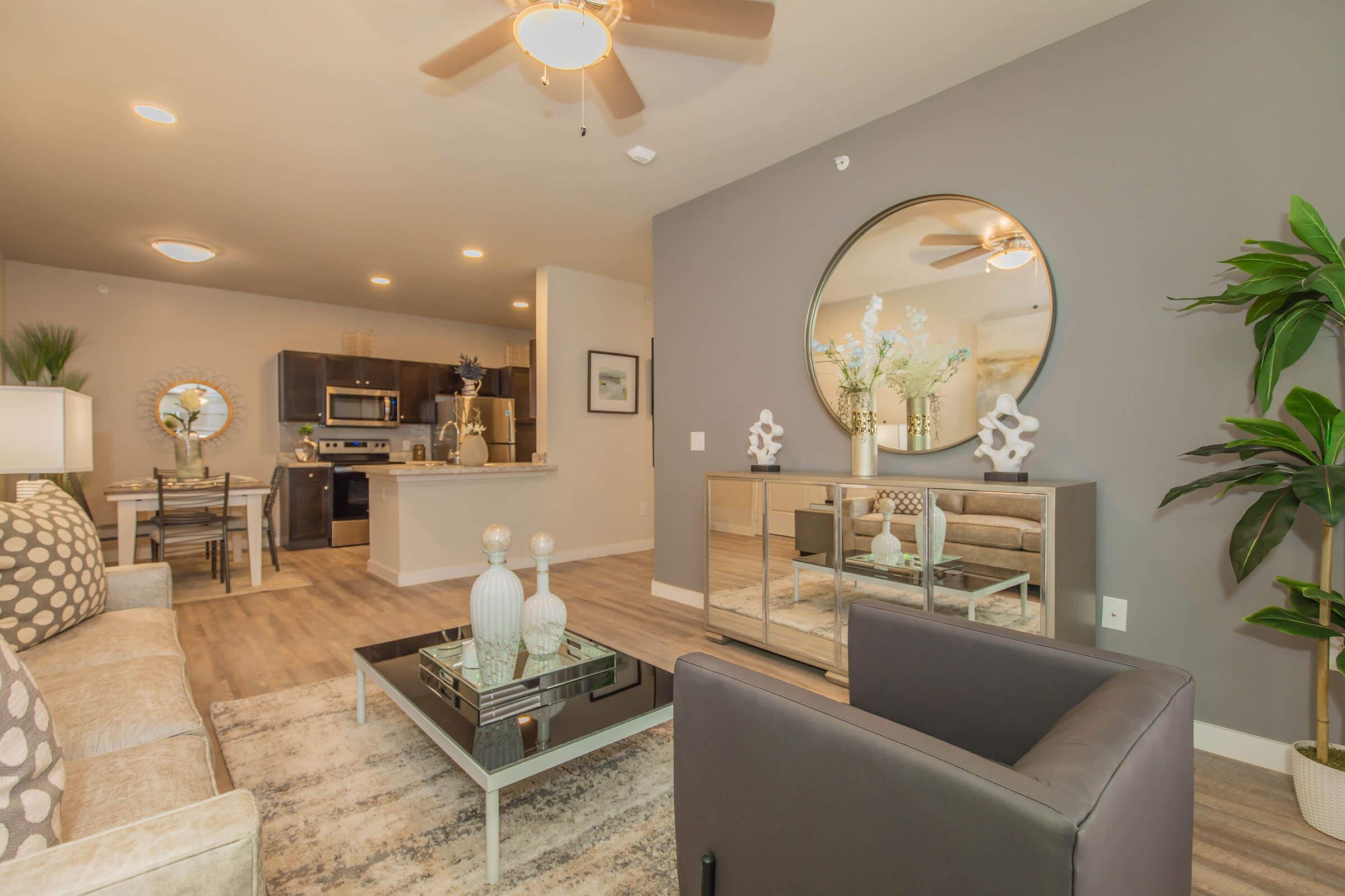 a living room filled with furniture and a fireplace