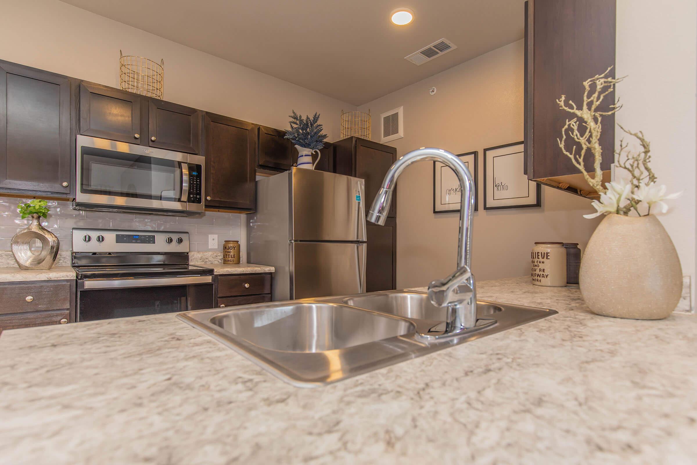 a large kitchen with stainless steel appliances