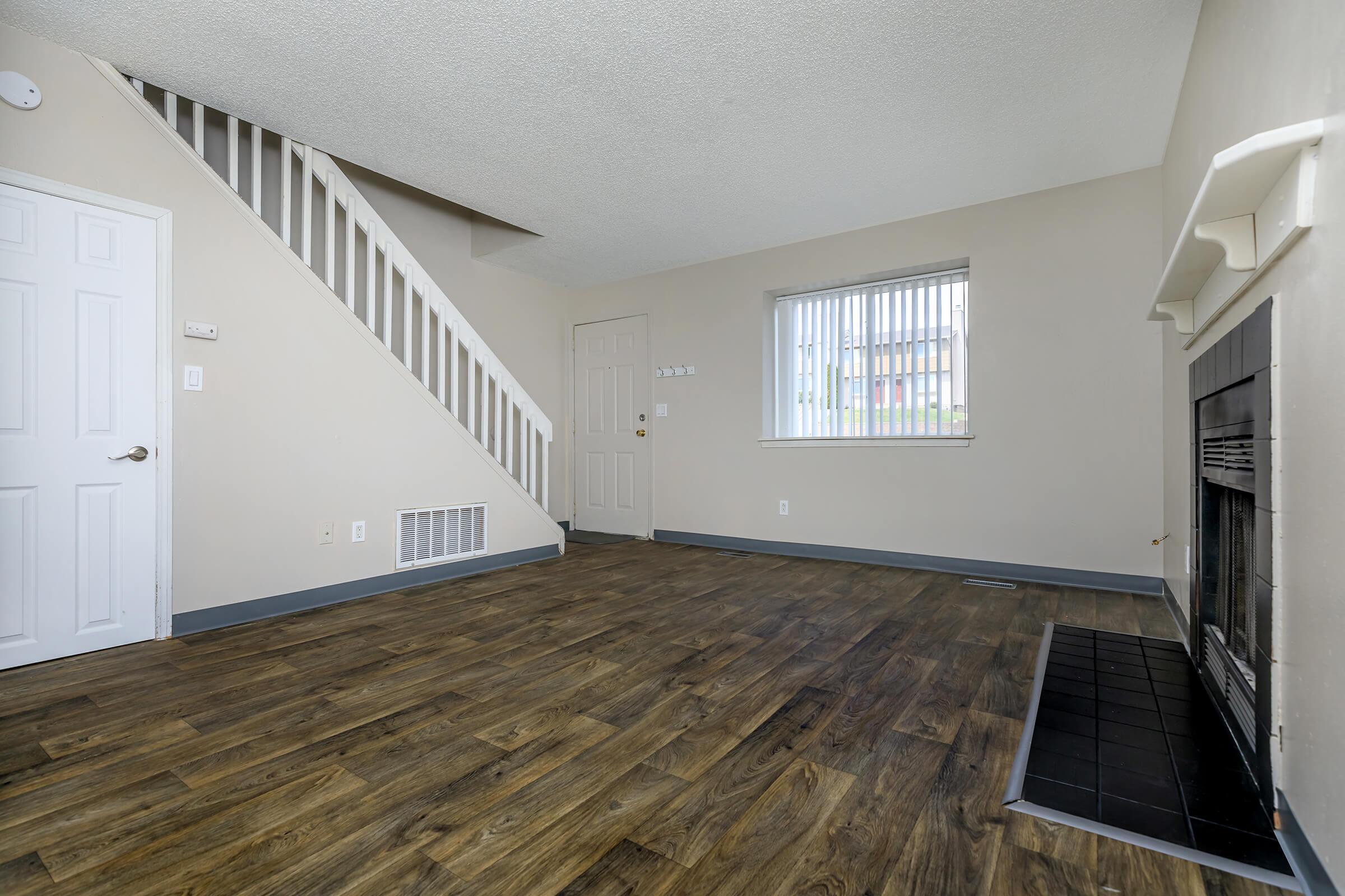 YOUR NEW LIVING ROOM AT WOODSIDE APARTMENT HOMES