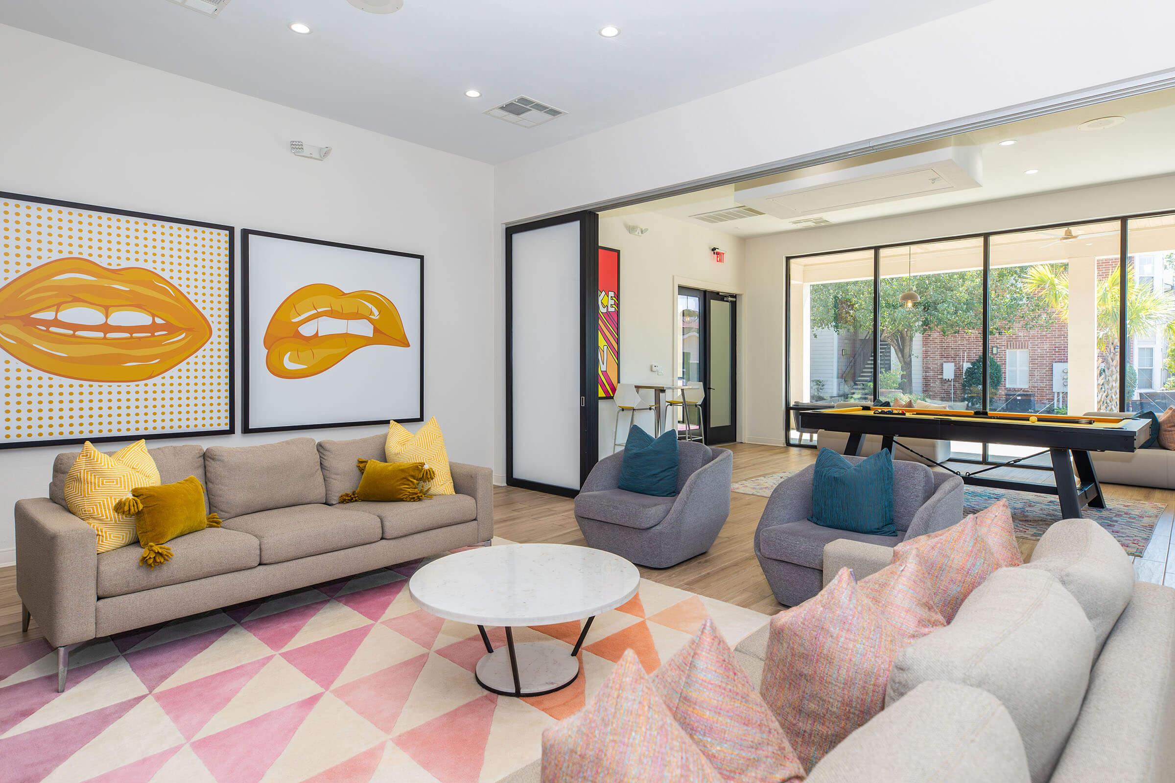 a living room filled with furniture and a flat screen tv