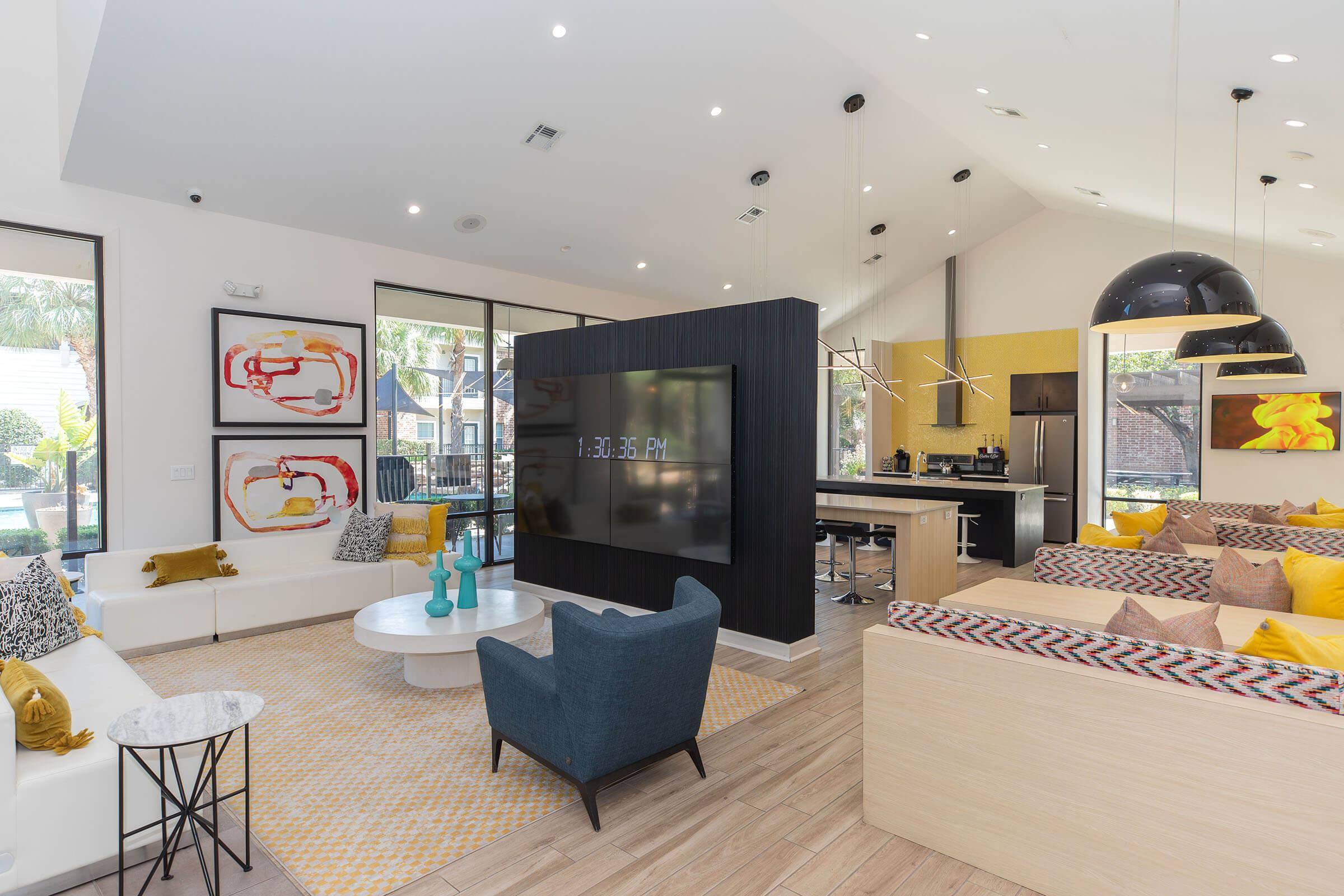 a living room filled with furniture and a large window