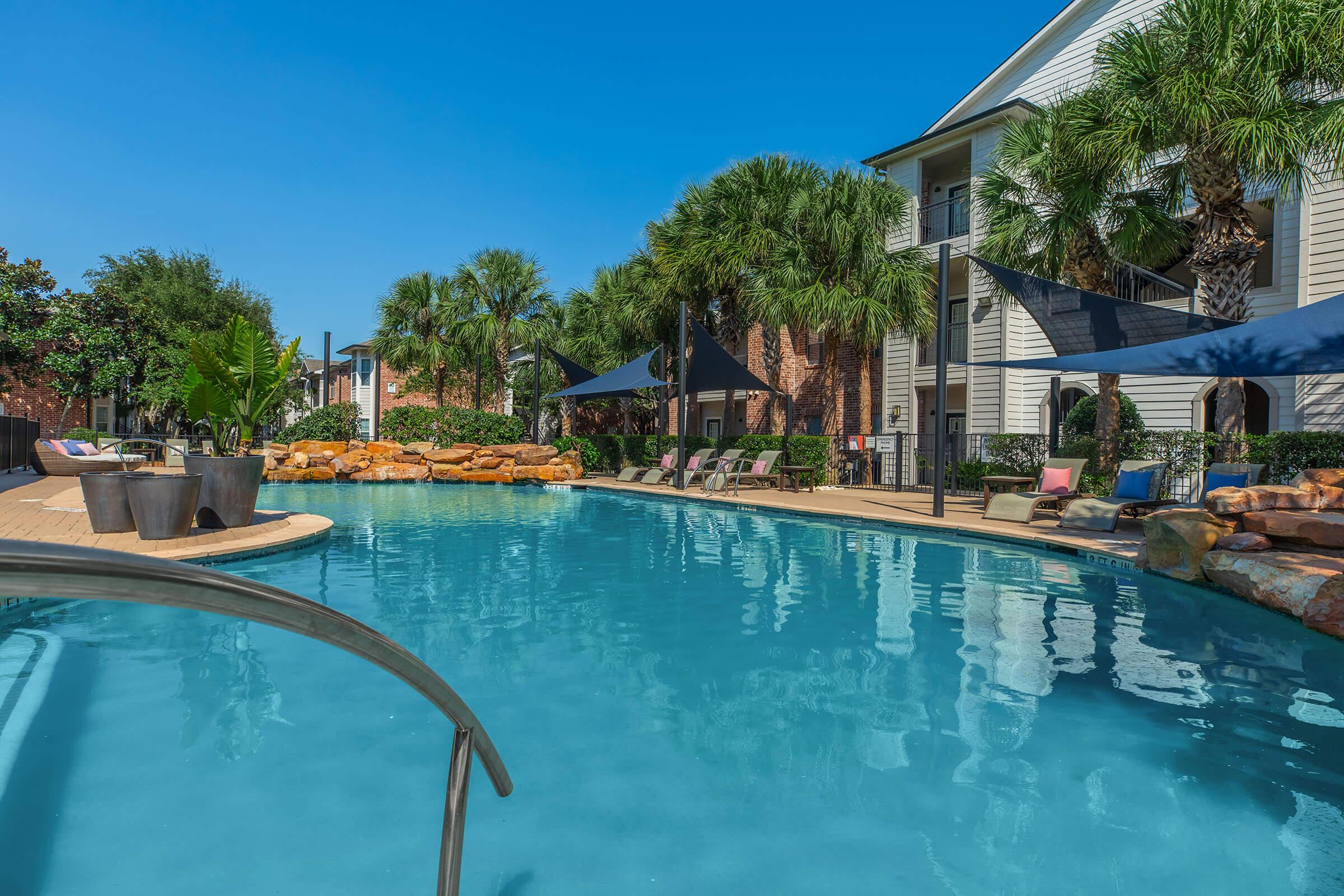 a pool next to a body of water