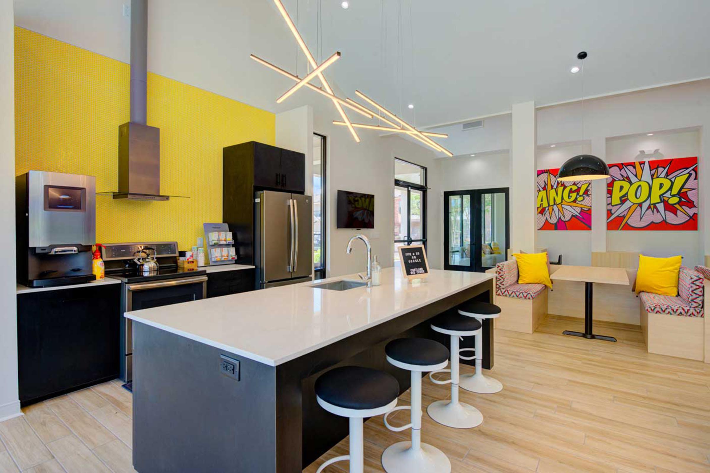 a kitchen with an island in the middle of a room