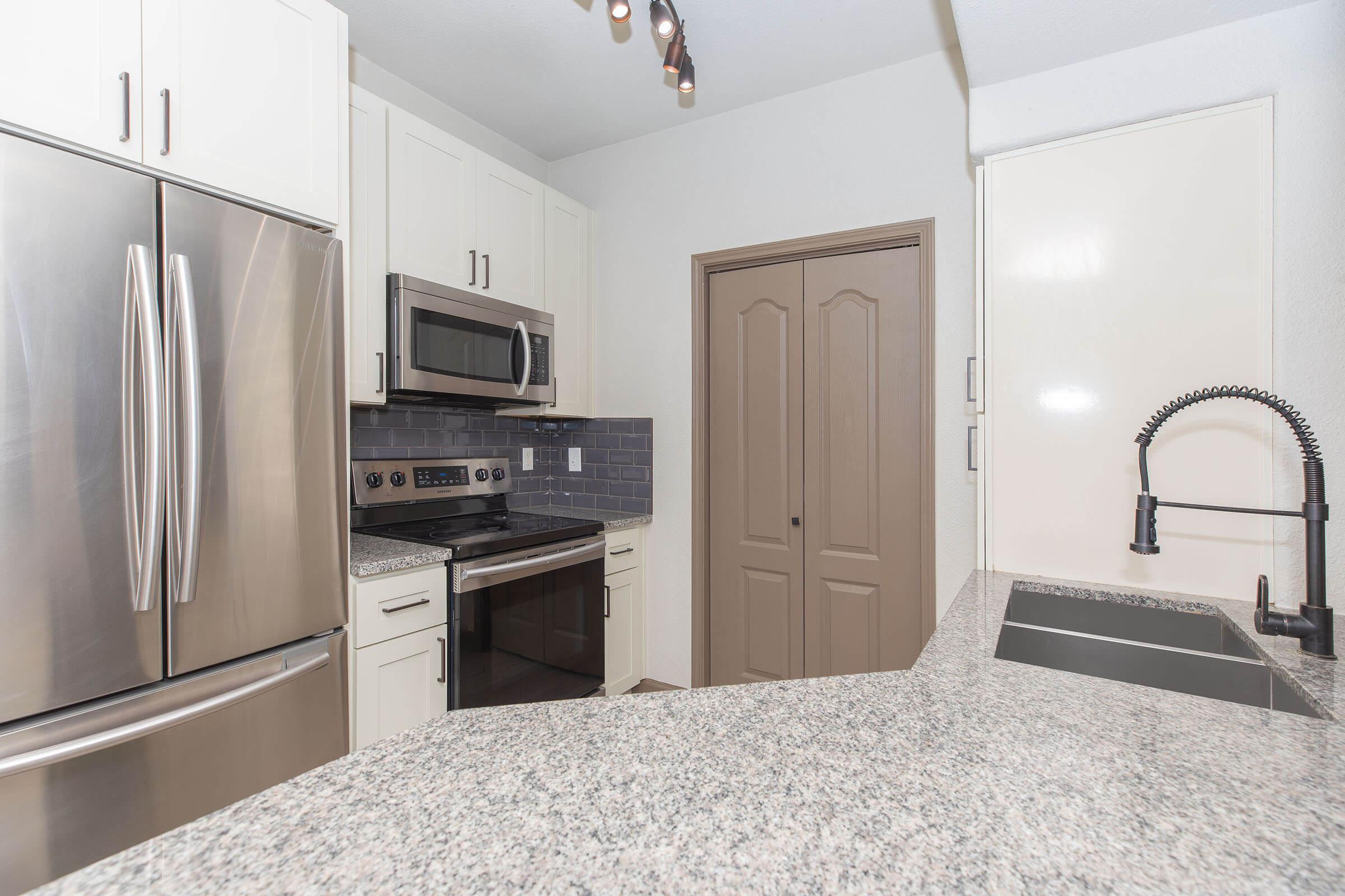 a stainless steel refrigerator in a kitchen