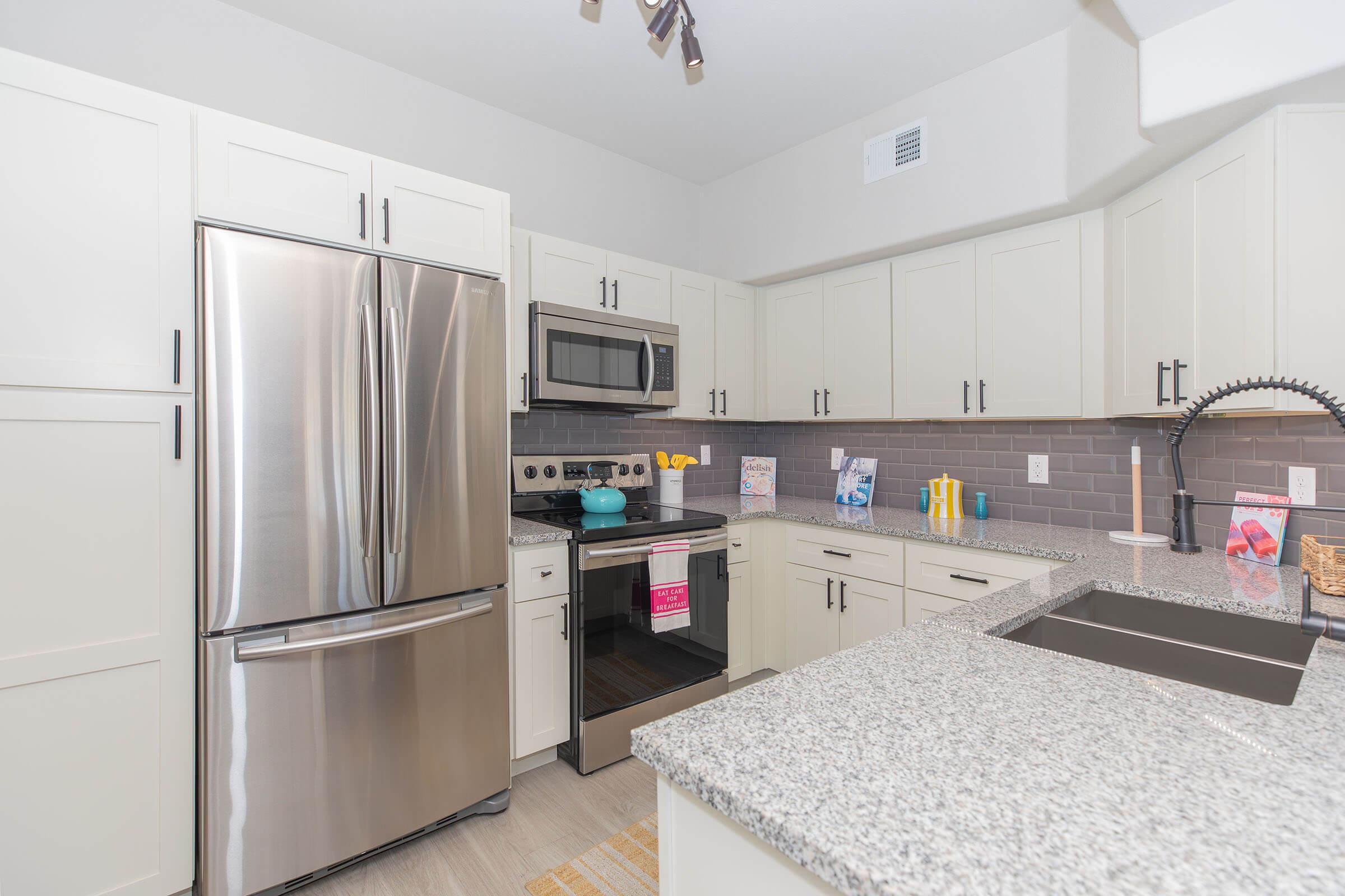 a stainless steel refrigerator in a kitchen