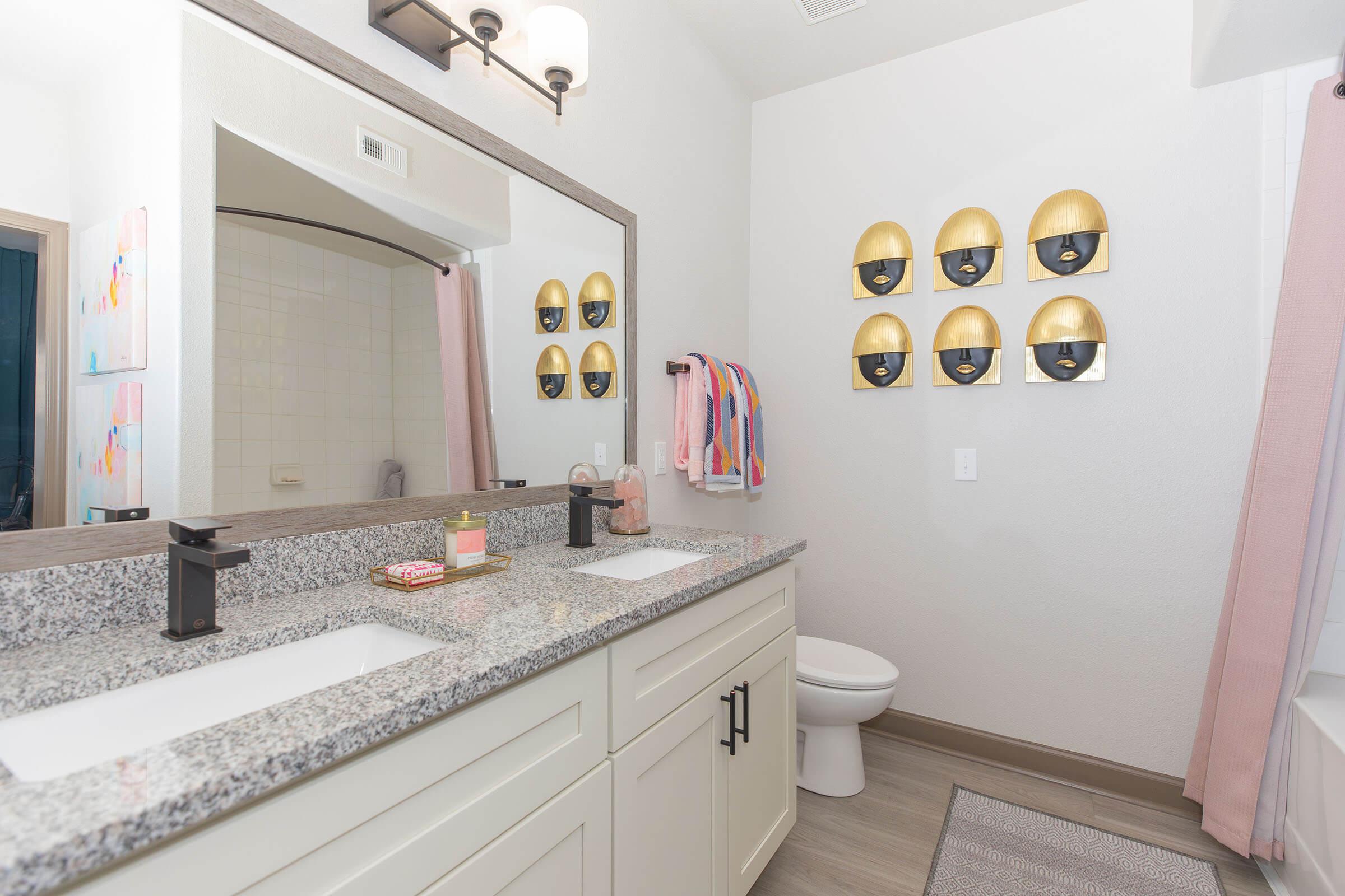 a kitchen with a sink and a mirror