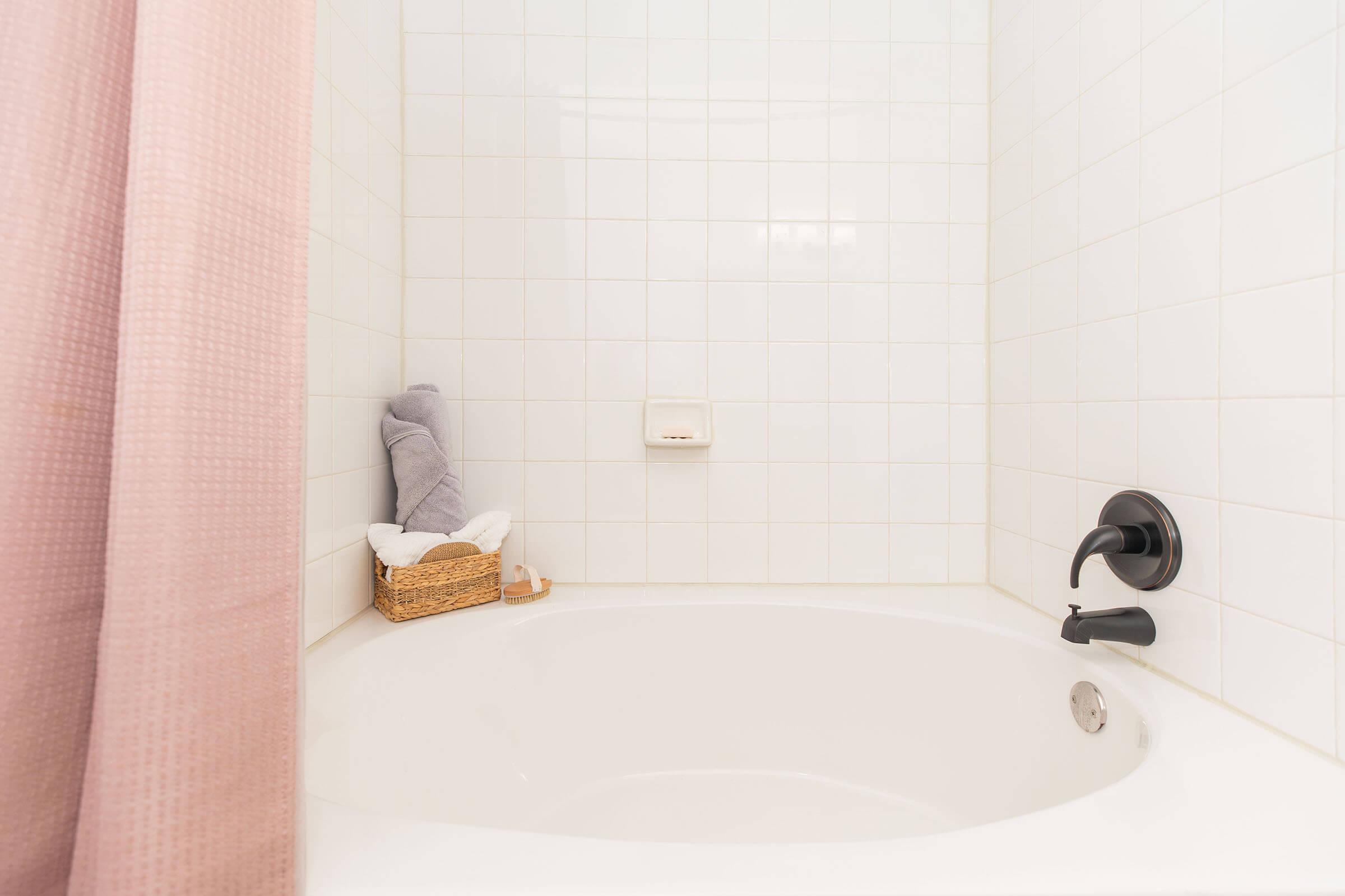 a close up of a sink and a bath tub