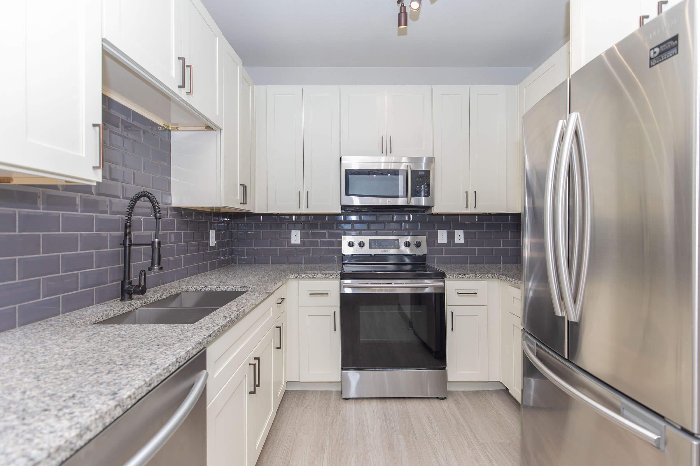 a modern kitchen with stainless steel appliances