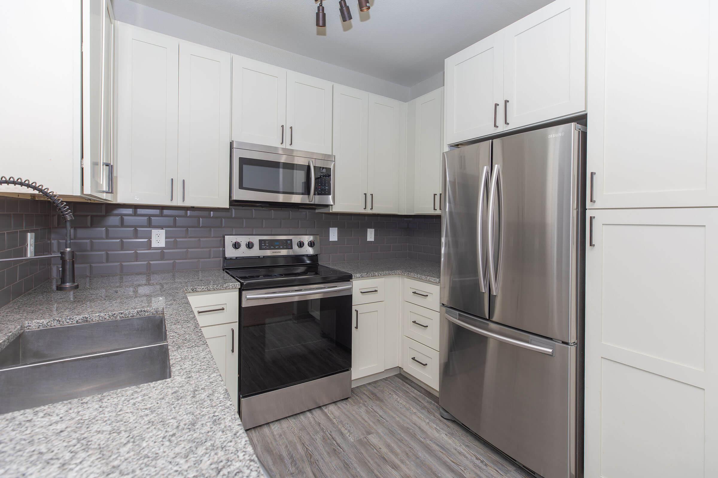 a stainless steel refrigerator in a kitchen