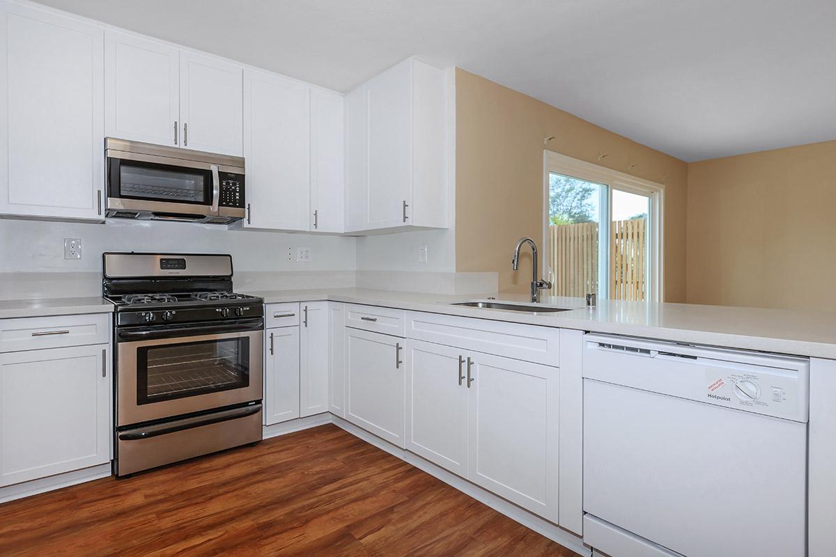 a kitchen with a stove and a microwave