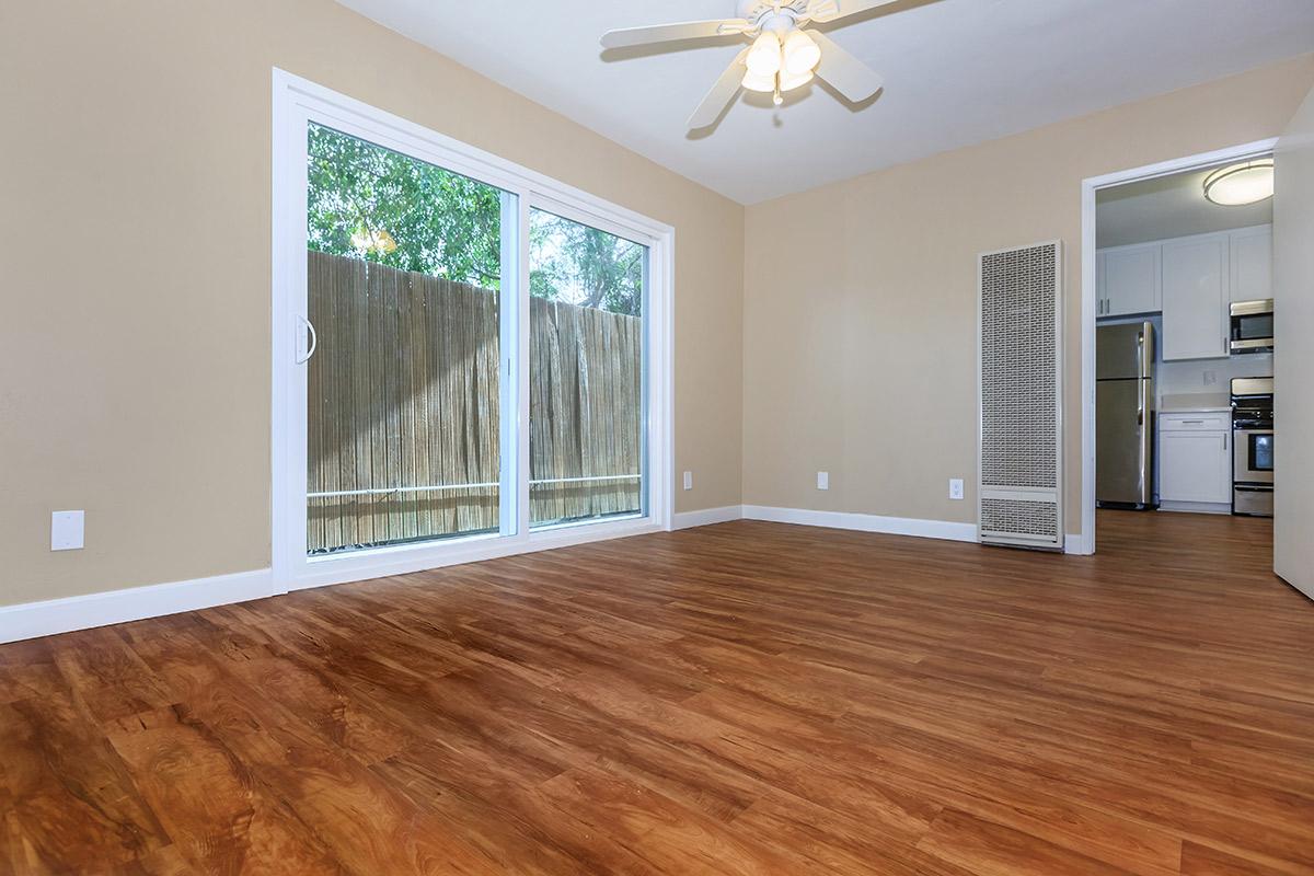 a large empty room with a wood floor