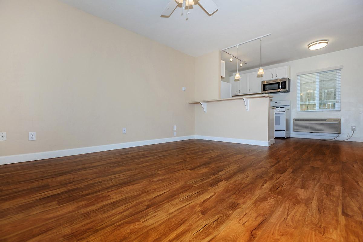 a kitchen with a wood floor