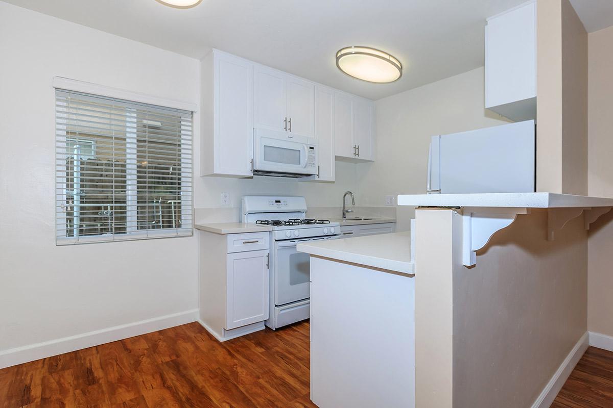 a large white refrigerator in a kitchen