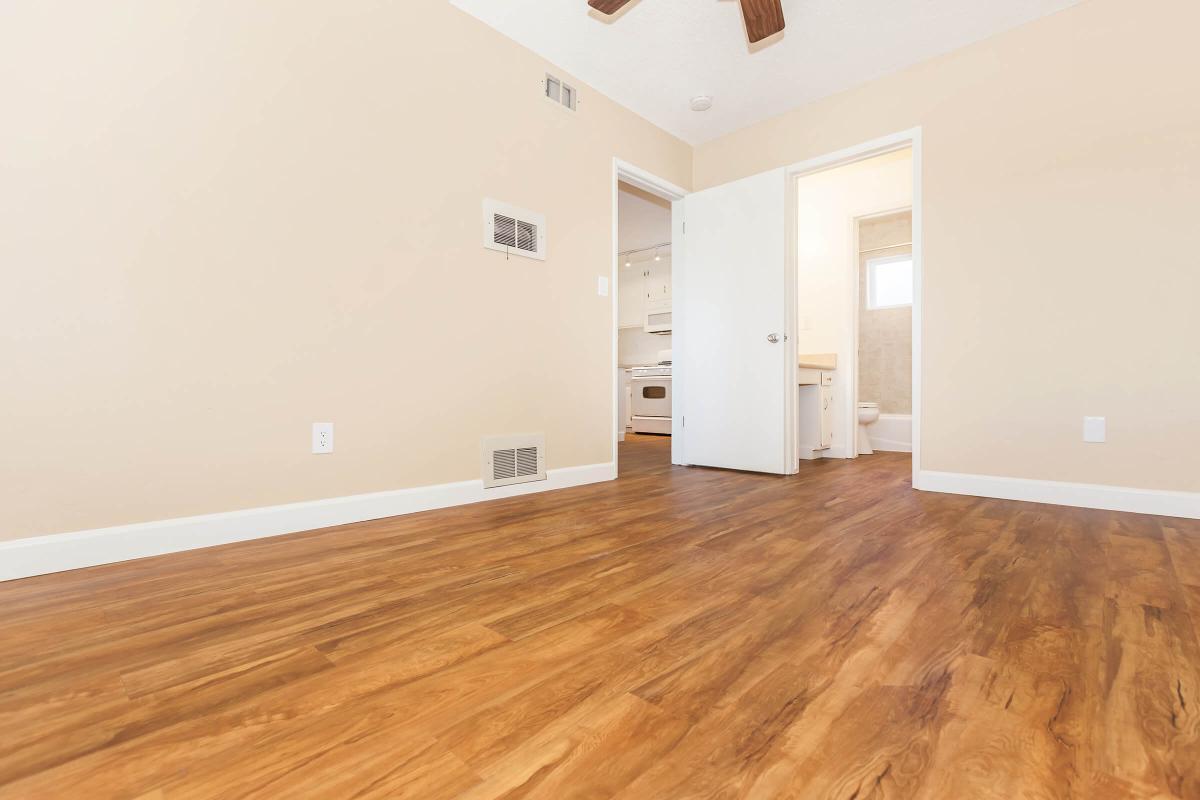 a large white building with a wooden floor