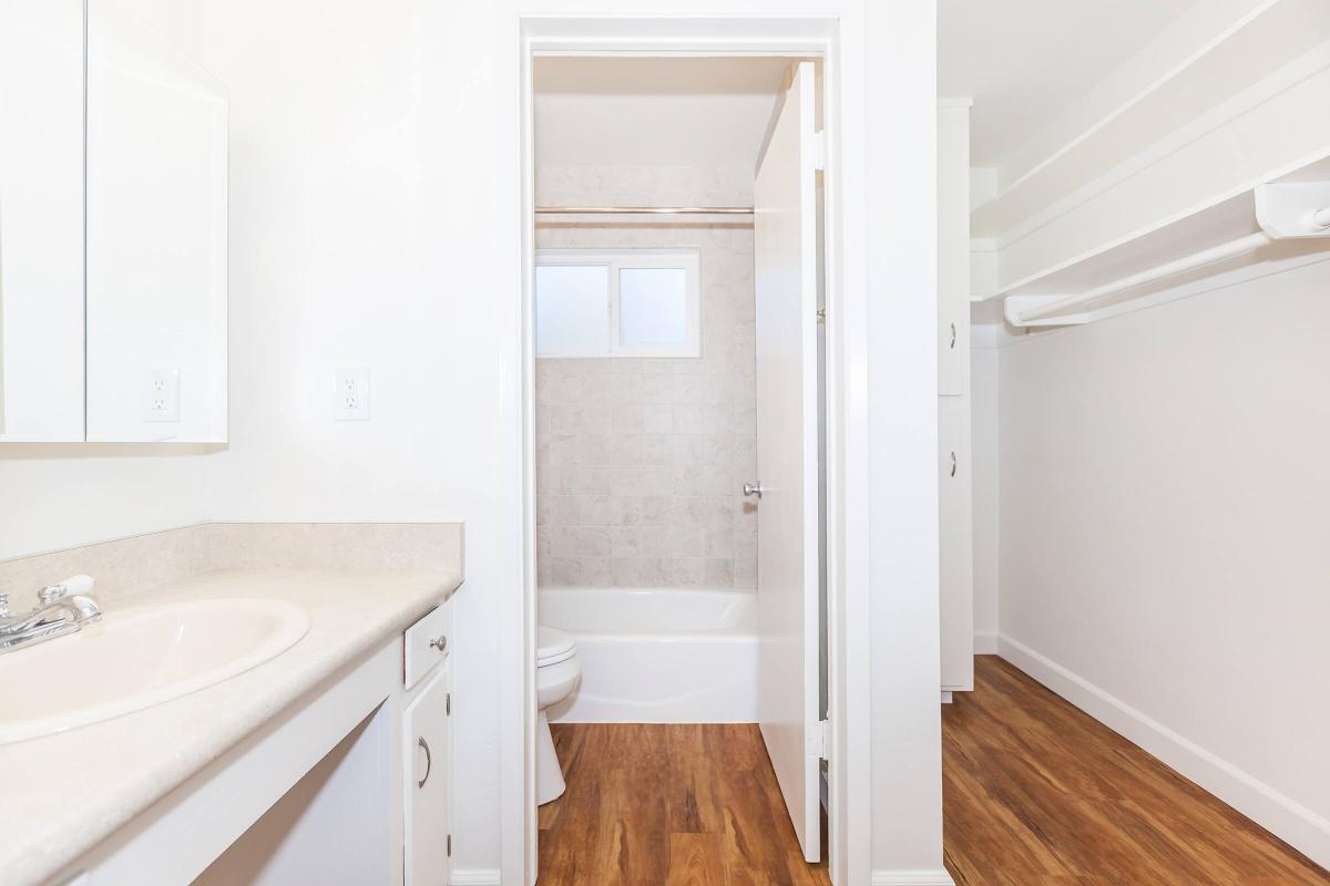 a white sink sitting next to a door