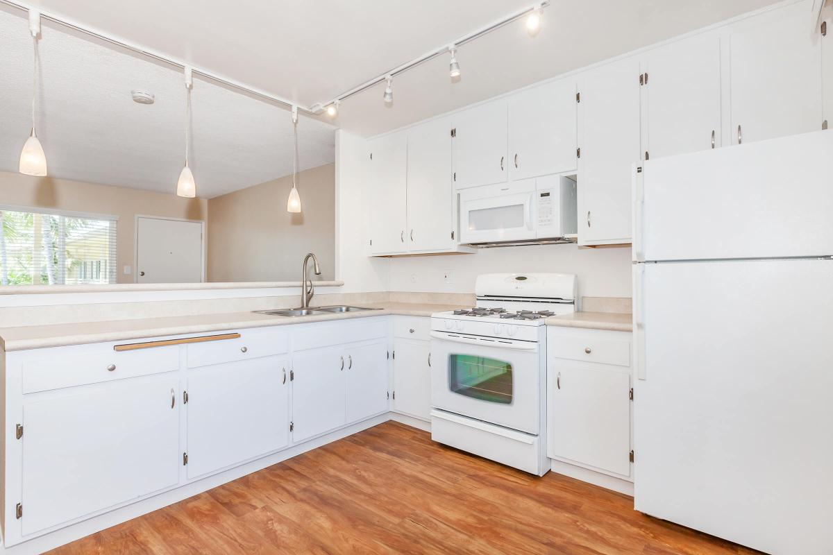 a large white refrigerator in a kitchen