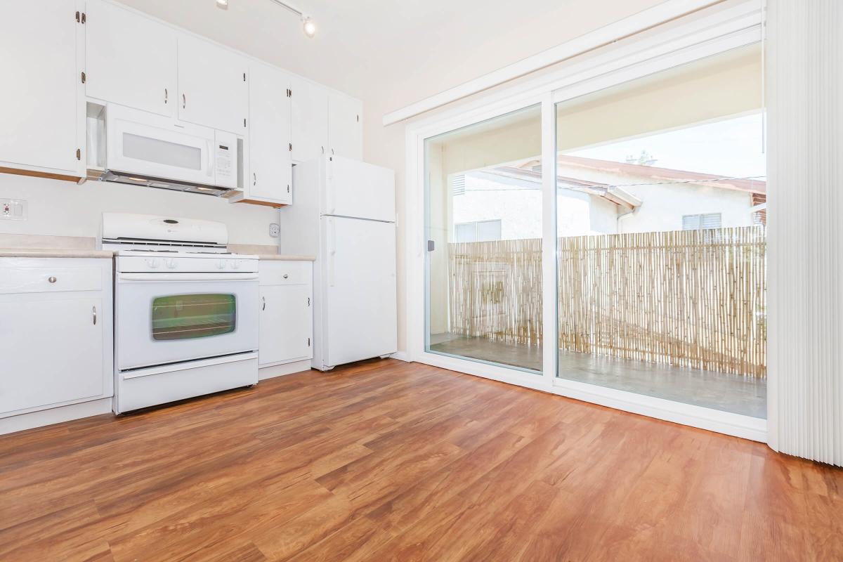 a kitchen with a wood floor