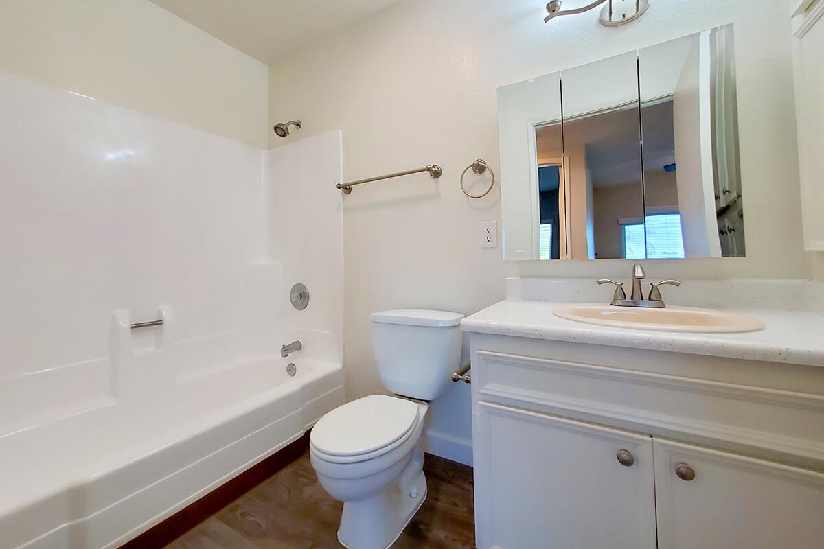 a large tub next to a sink