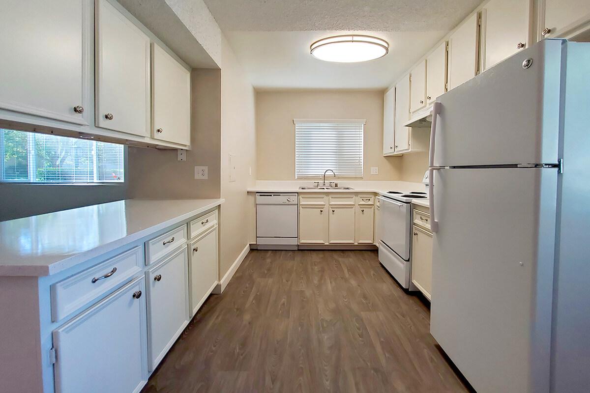 a kitchen with a wood floor