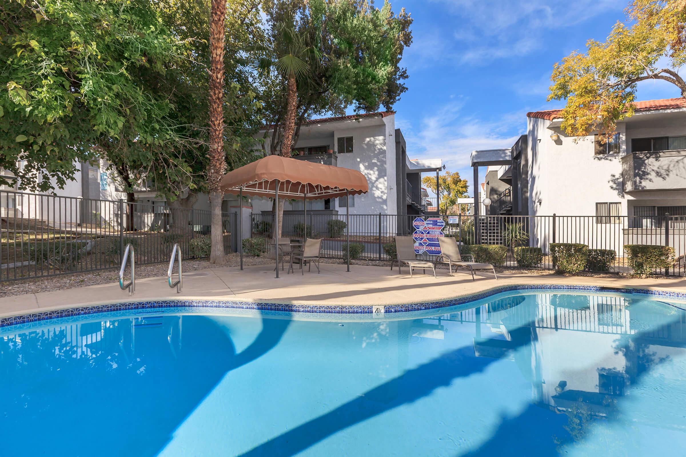 RELAX BESIDE OUR SHIMMERING SWIMMING POOL AT VILLA DEL SOL IN LAS VEGAS