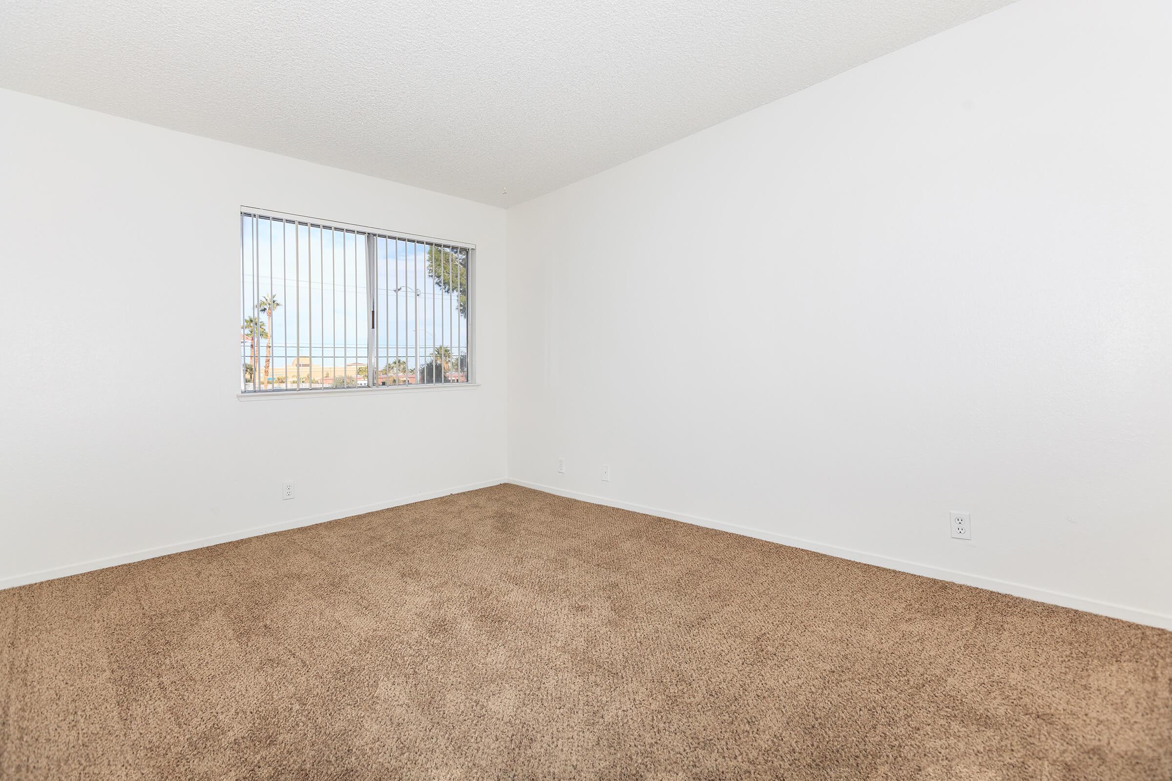 a bedroom with a bed in a room