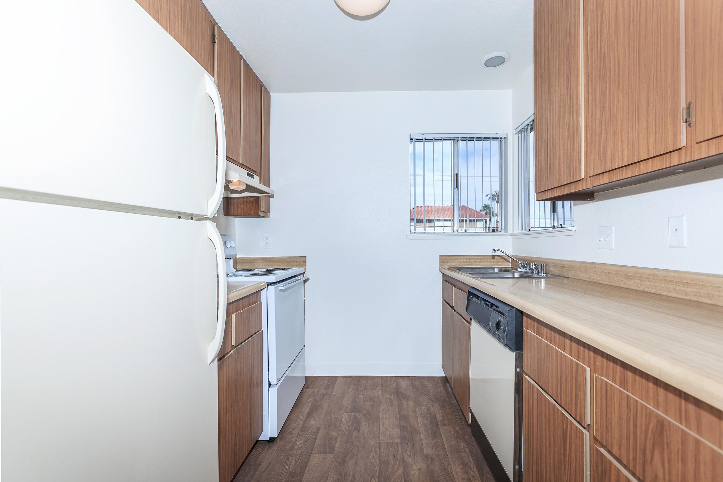 a kitchen with a stove and a refrigerator