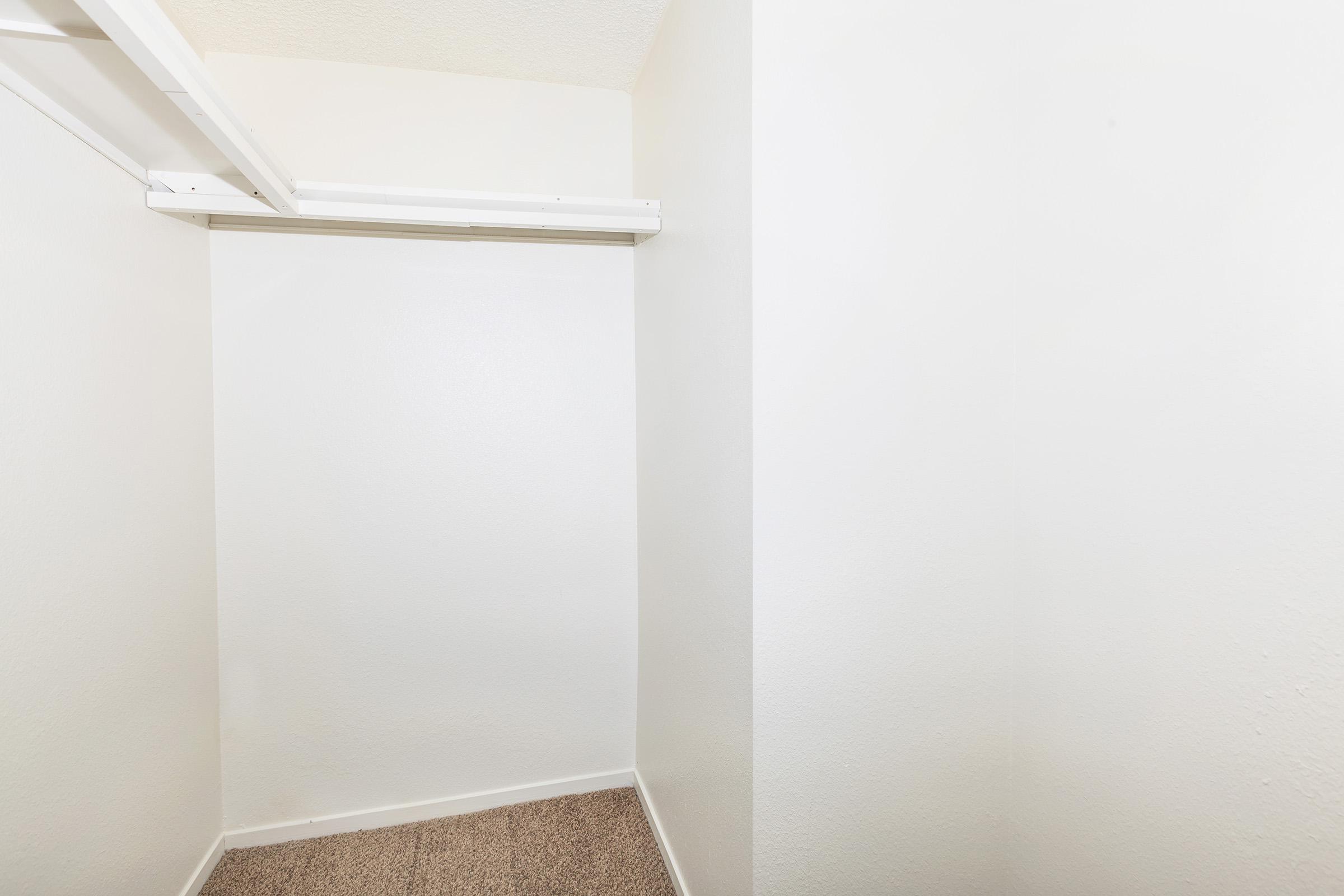a white tub sitting next to a shower
