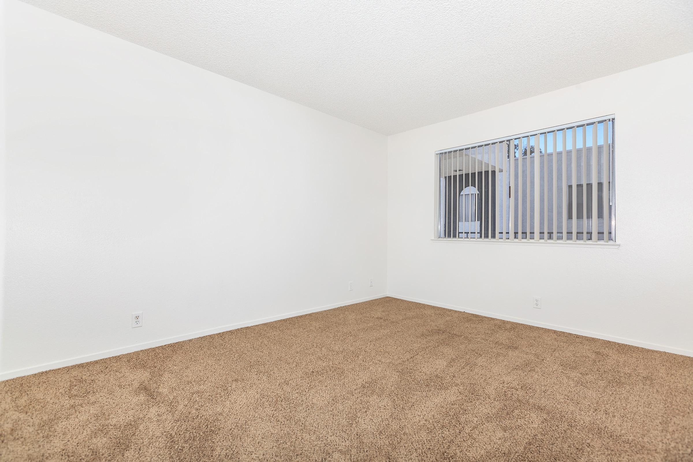 an empty bed in a room