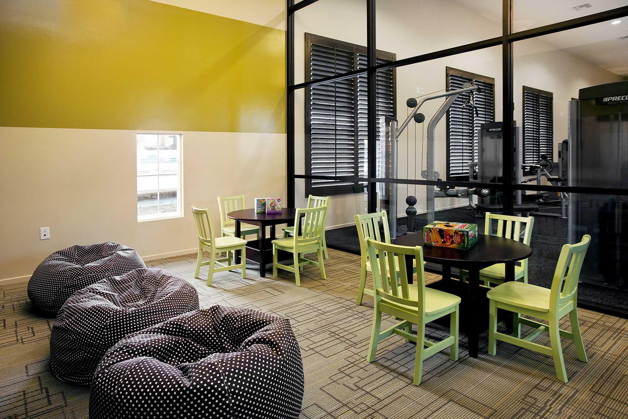 a room with bean bag chairs and tables