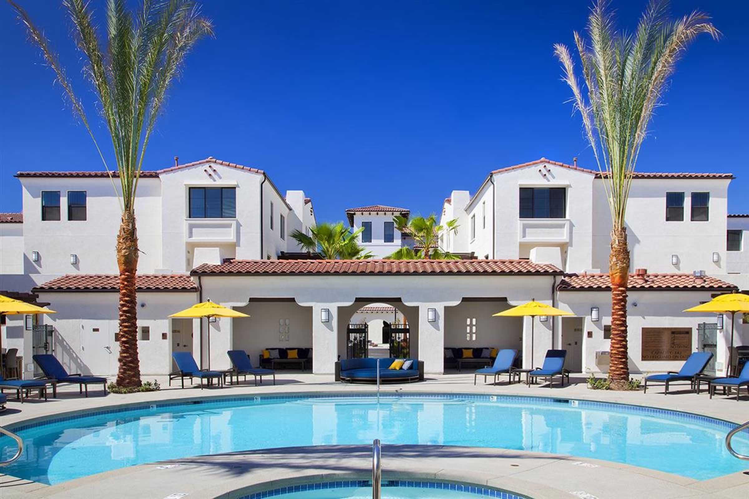 lounge chairs around a pool