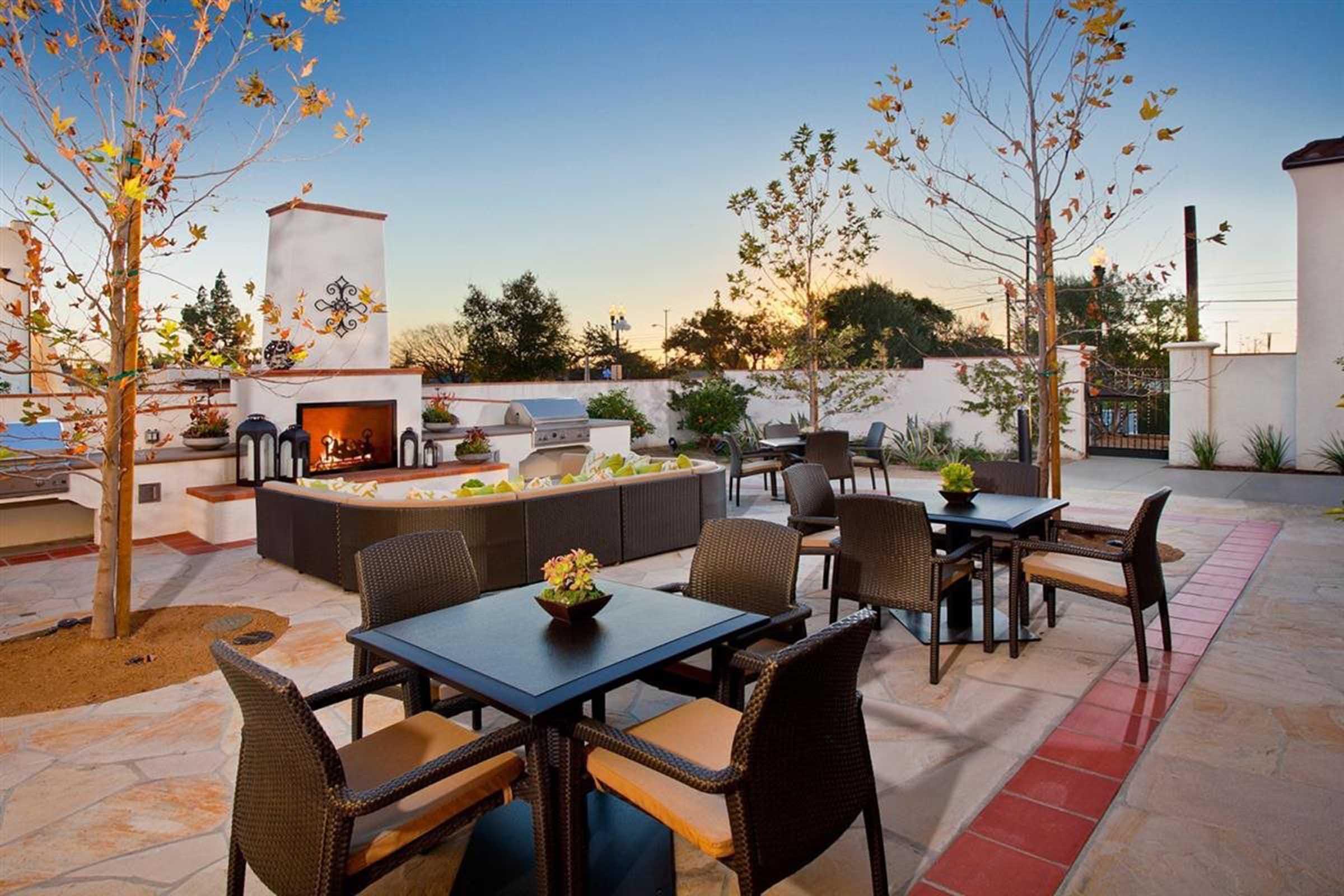 tables outside around a fire pit