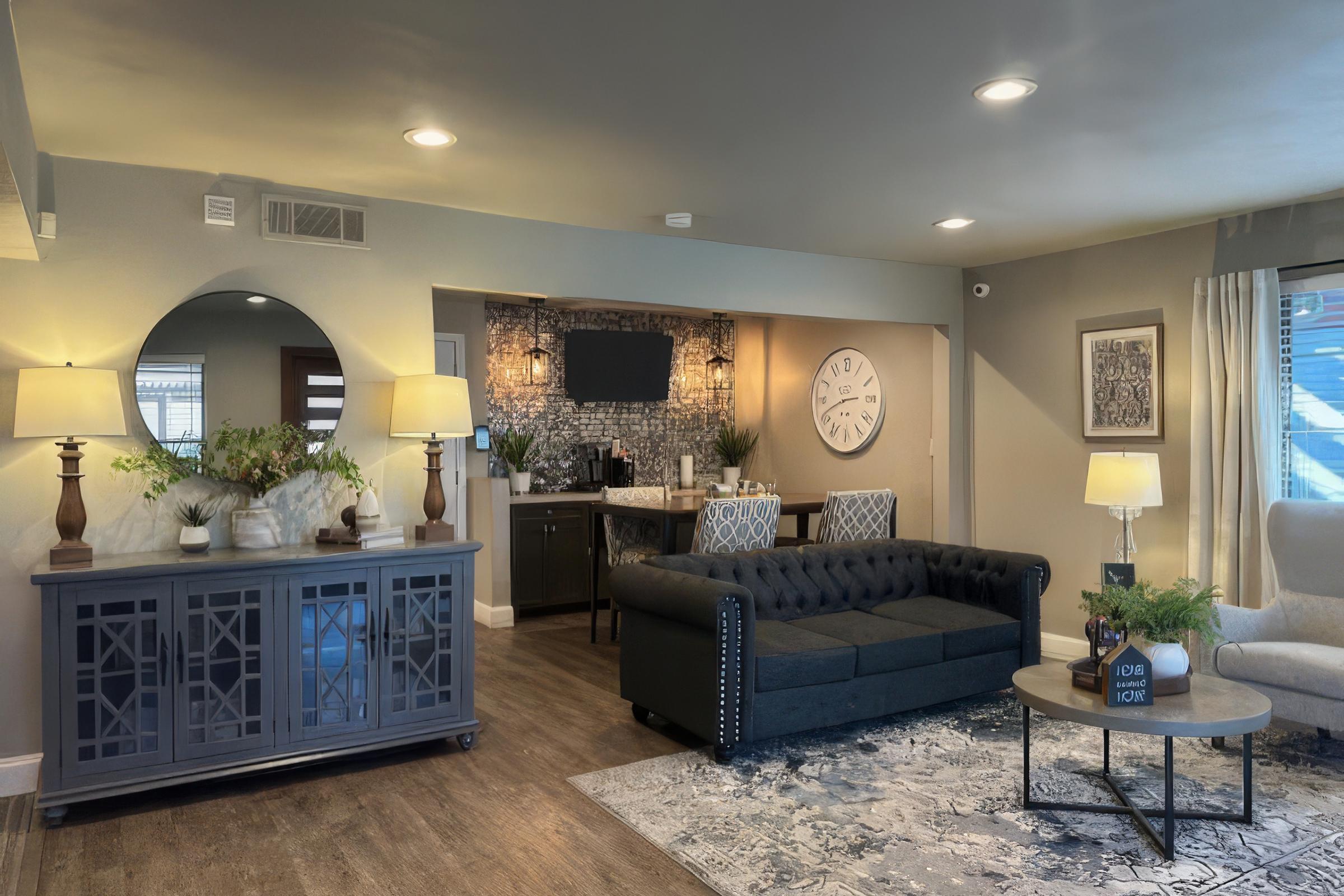 a living room filled with furniture and a flat screen tv