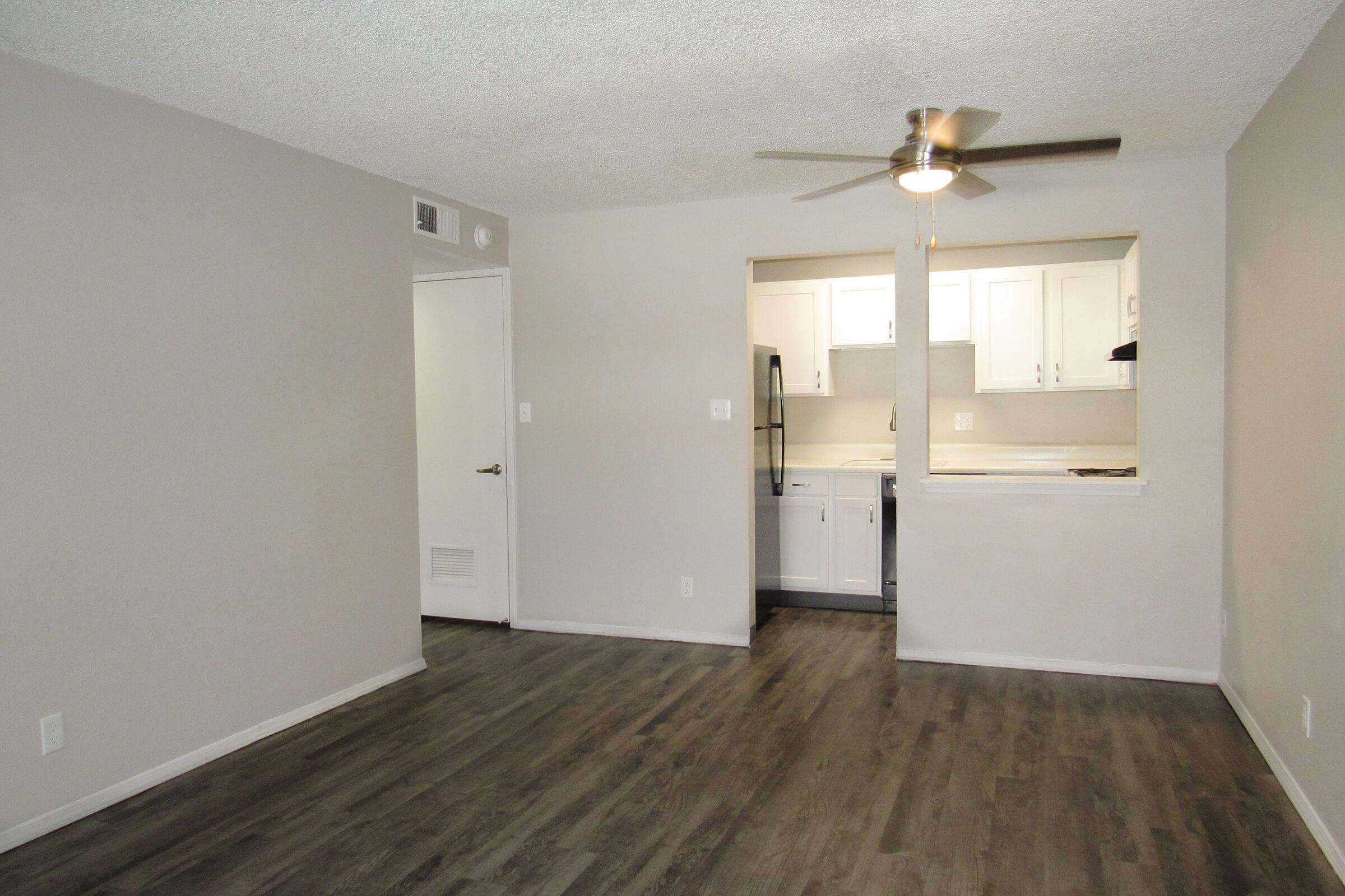 a kitchen with a sink and a refrigerator