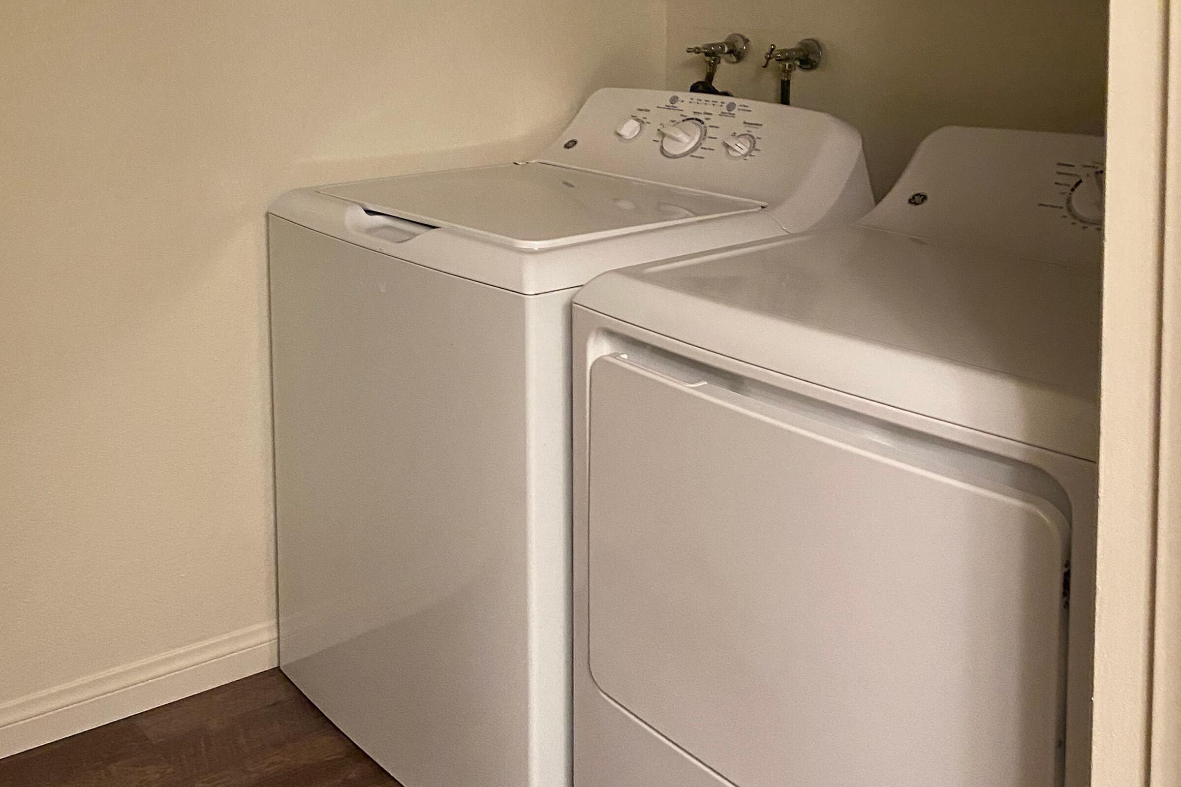 a white refrigerator freezer sitting in a box