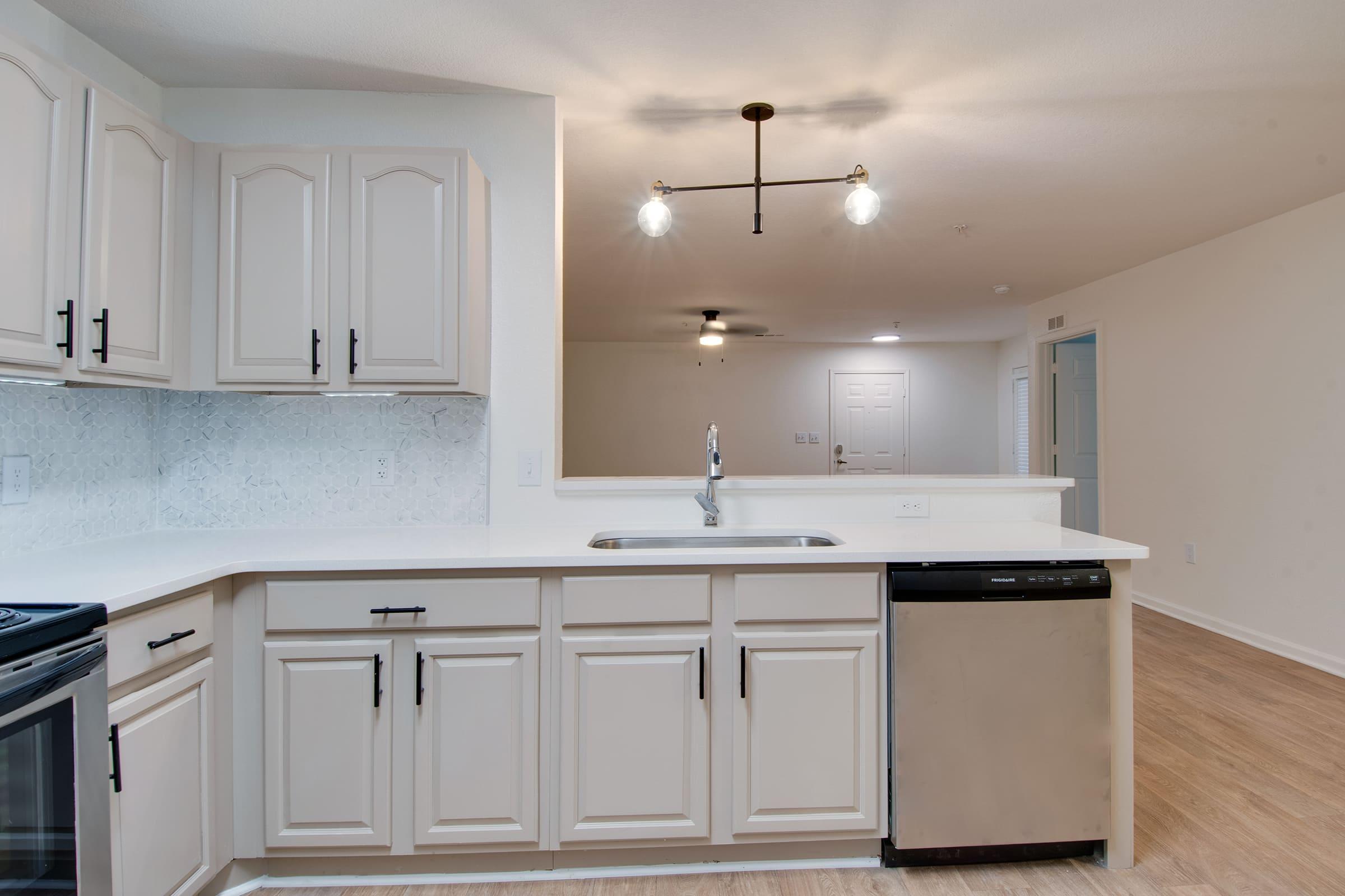 a kitchen with a sink and a microwave