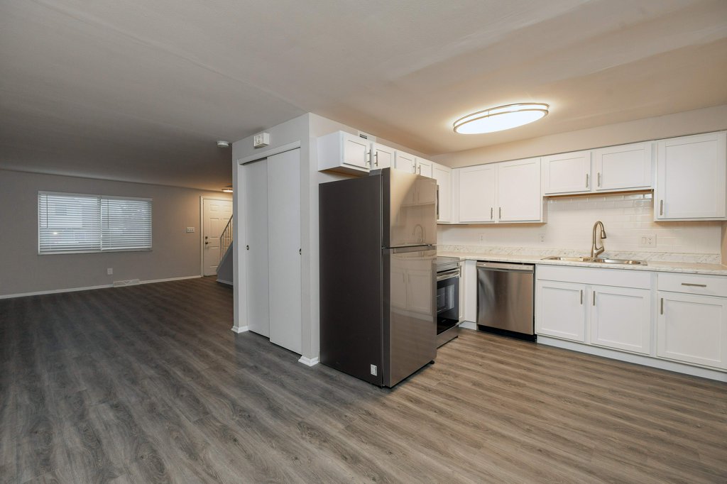 a kitchen with a wood floor