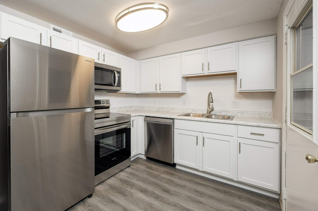 a stainless steel refrigerator in a kitchen