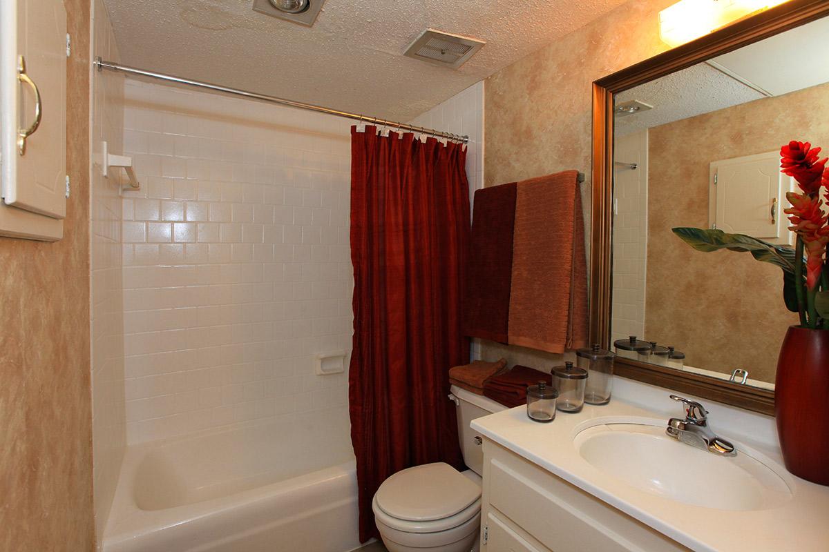 a large white tub sitting next to a sink