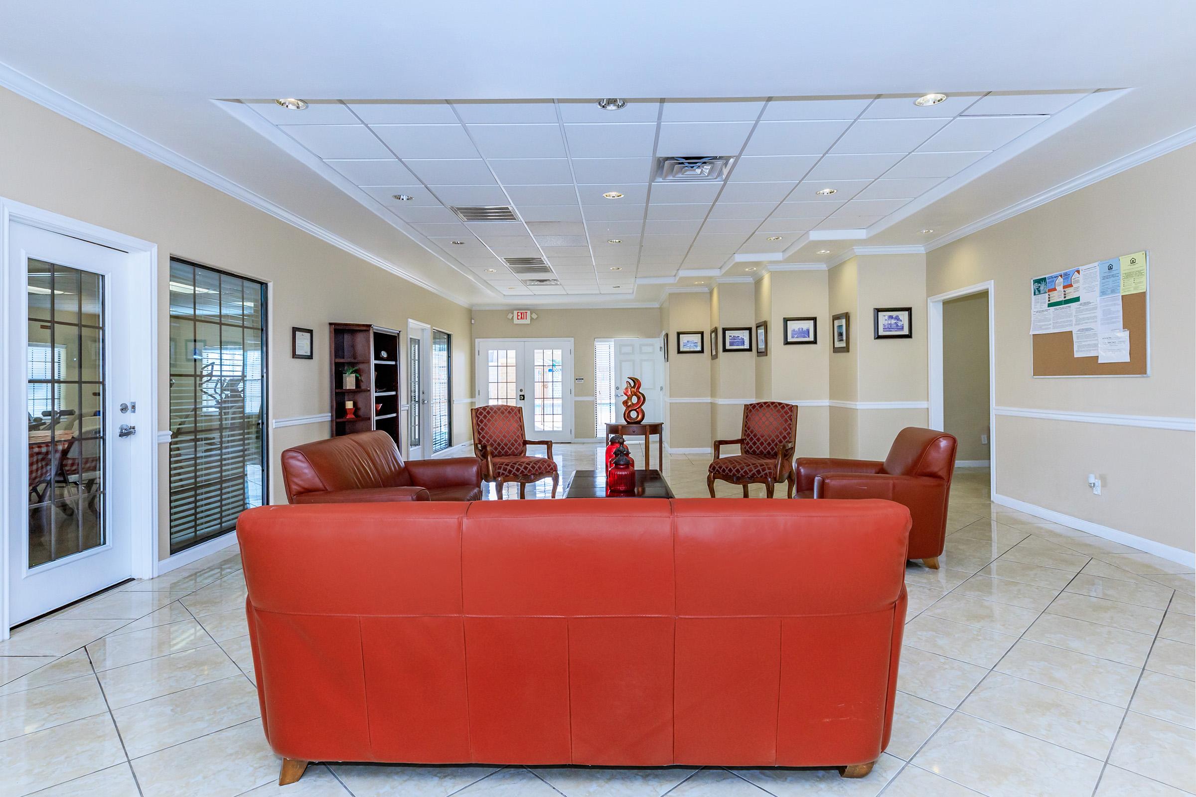 a room filled with furniture and a large window